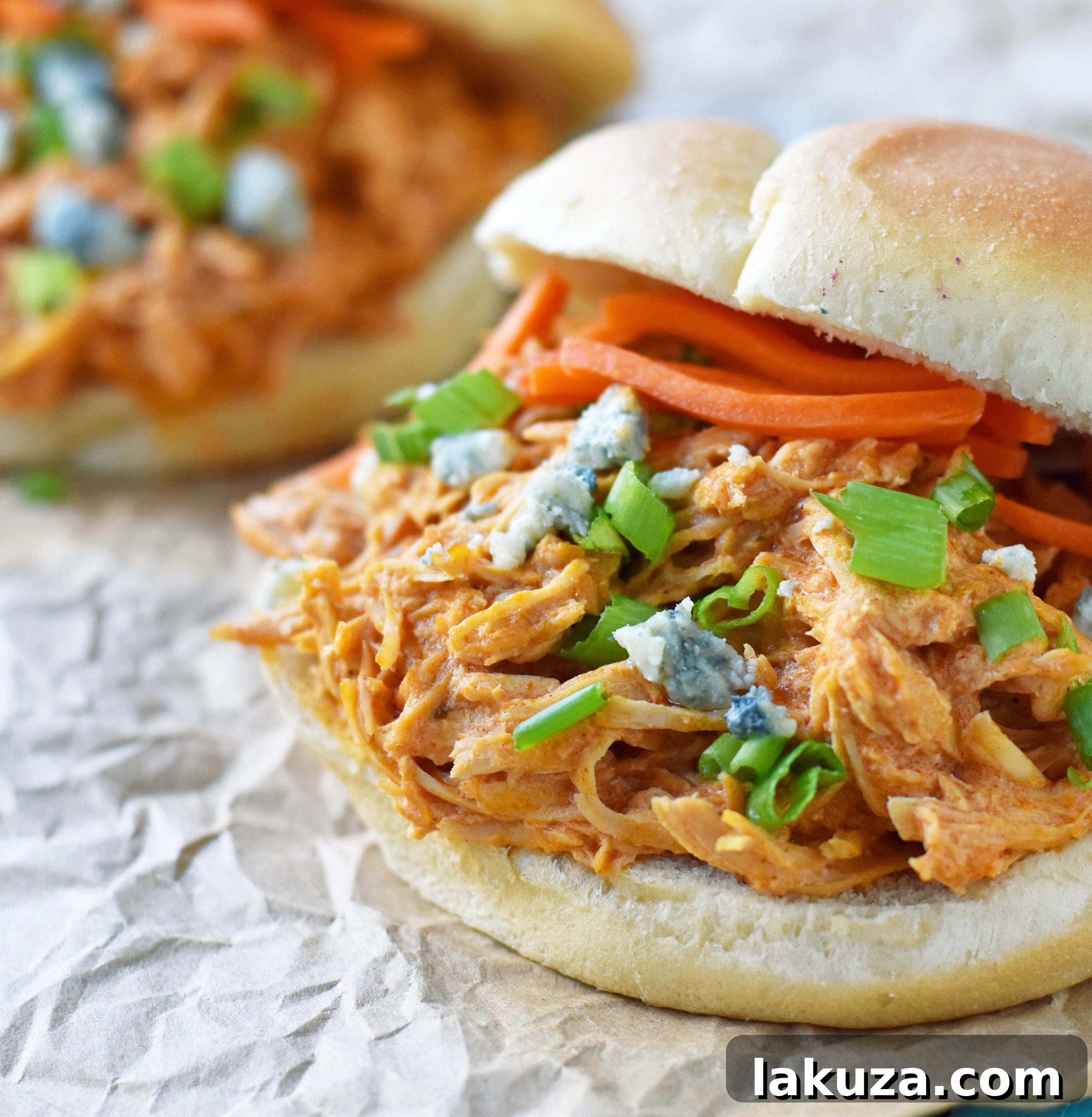 Zesty Creamy Slow Cooker Buffalo Ranch Chicken 3 Juicy Buffalo Ranch Chicken cooked to perfection in a slow cooker, featuring tender chicken breast, a harmonious blend of spicy buffalo sauce, tangy ranch seasoning, and rich cream cheese. This versatile dish is excellent for Buffalo Chicken Sliders or as a flavorful protein in various meals.