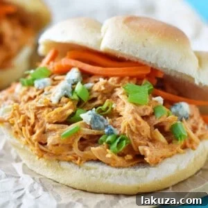 Zesty Creamy Slow Cooker Buffalo Ranch Chicken 5 Buffalo Ranch Slow Cooker Chicken made with chicken breast, ranch dressing powder, buffalo wing sauce and cream cheese. This buffalo ranch chicken is made with only 4 ingredients. Can be made into buffalo chicken sliders. Perfect for football tailgate parties or potlucks. www.modernhoney.com