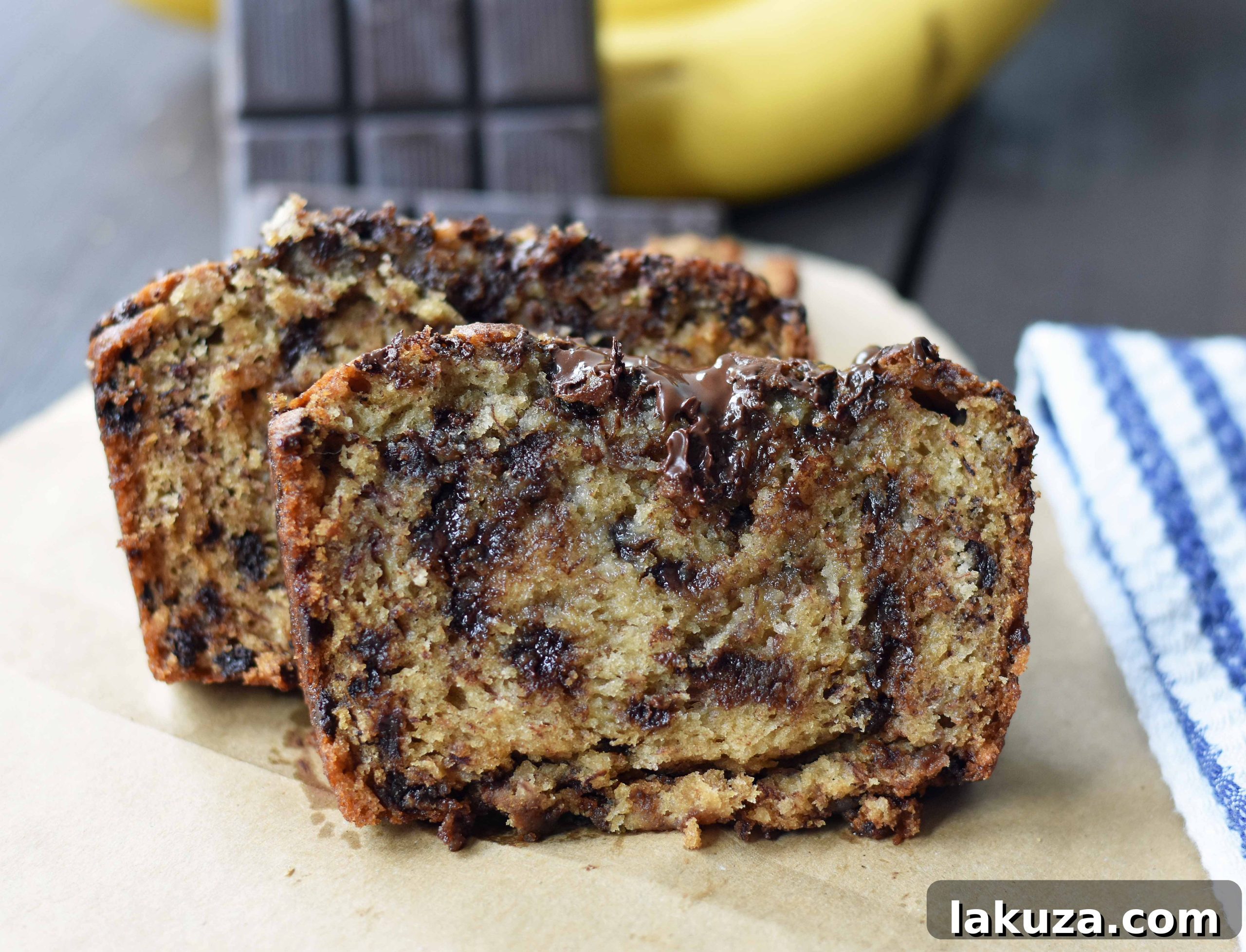 The best ever chocolate chip banana bread. Moist and delicious banana bread with chocolate chips. Banana bread made with butter, oil, and sour cream to create a perfect banana bread. www.modernhoney.com