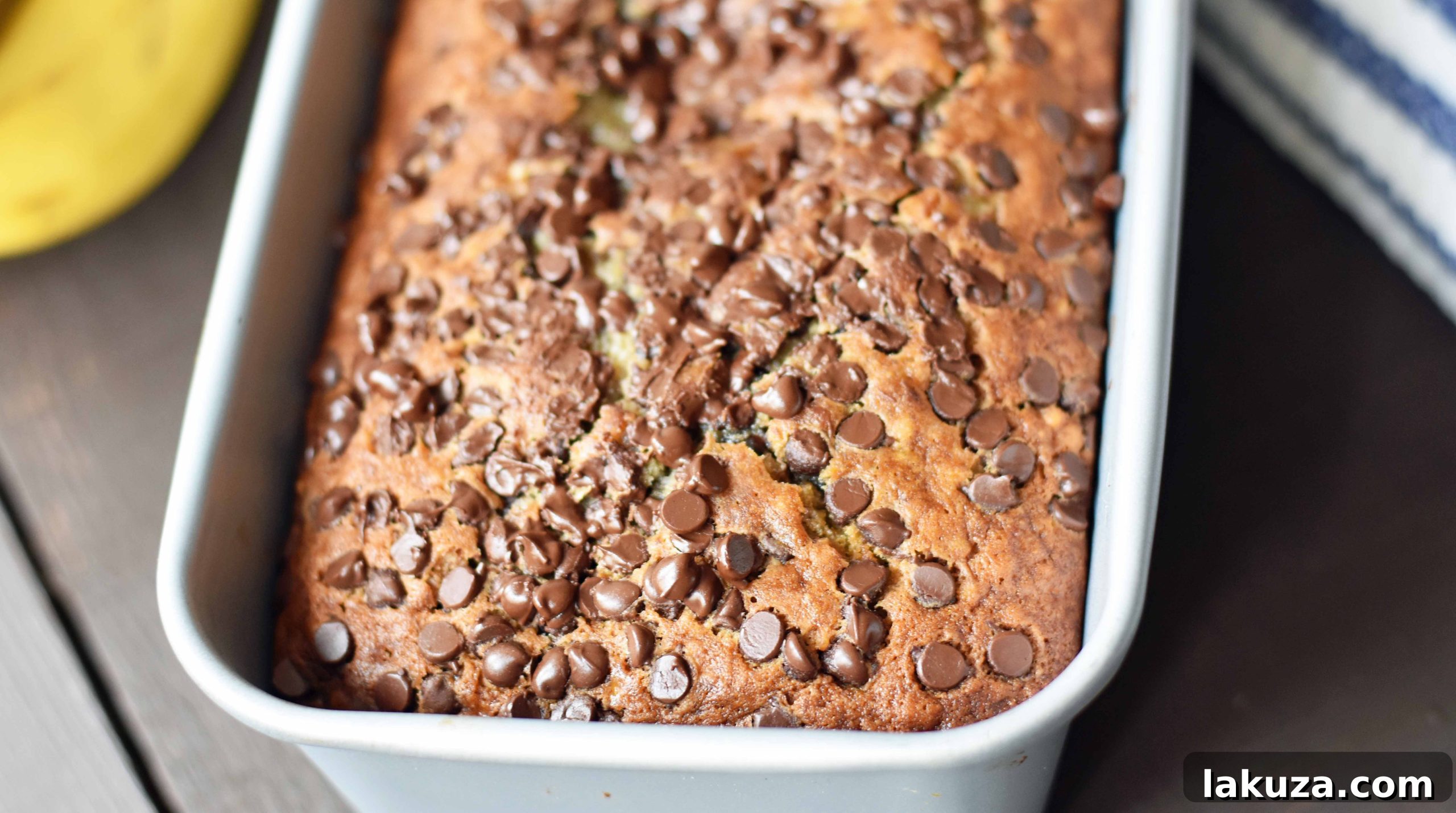 The best ever chocolate chip banana bread. Moist and delicious banana bread with chocolate chips. Banana bread made with butter, oil, and sour cream to create a perfect banana bread. www.modernhoney.com