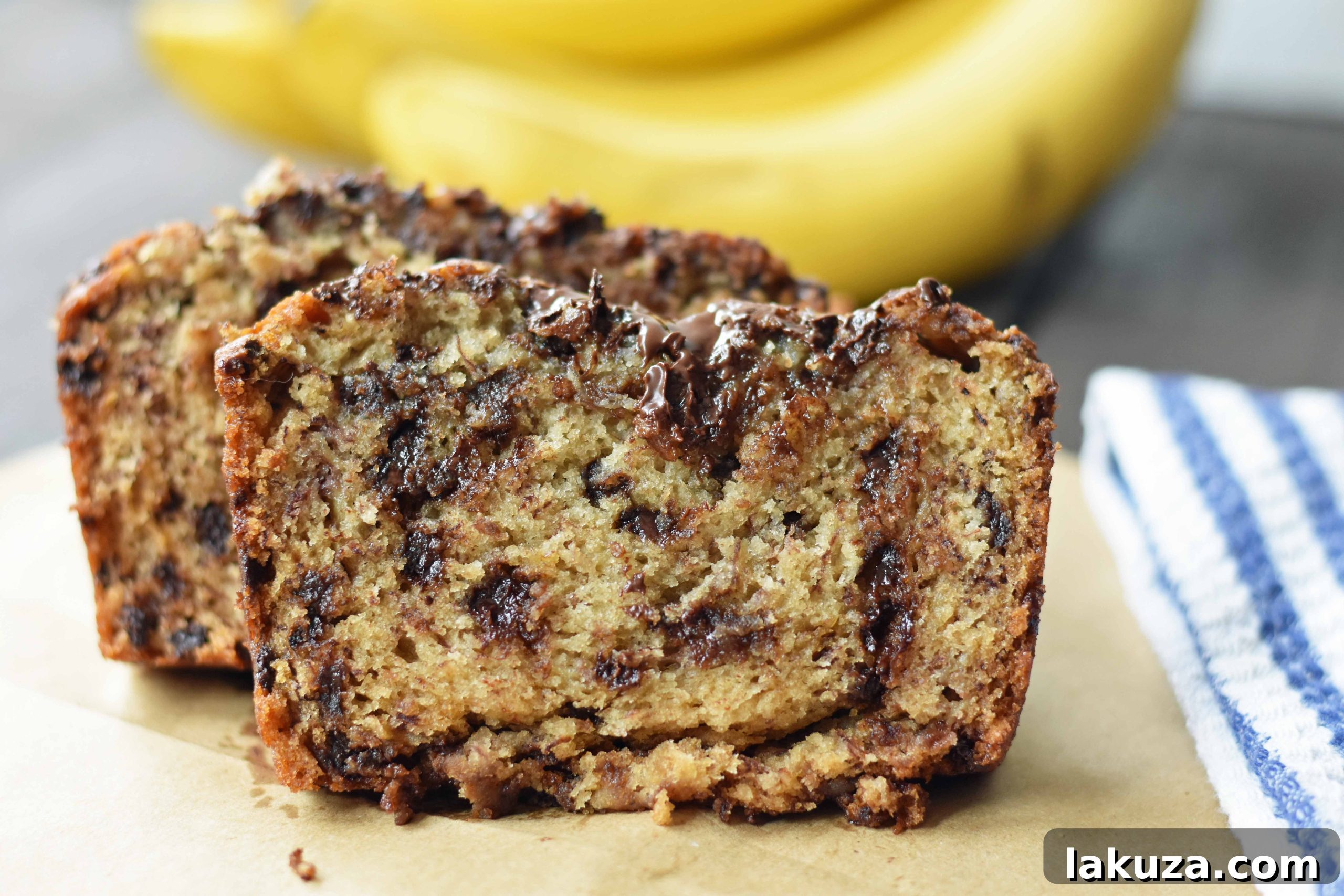 The best ever chocolate chip banana bread. Moist and delicious banana bread with chocolate chips. Banana bread made with butter, oil, and sour cream to create a perfect banana bread. www.modernhoney.com