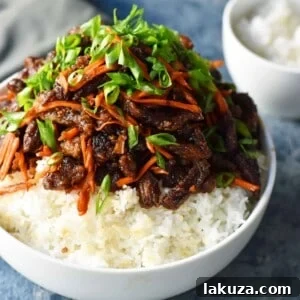 Mongolian Beef recipe. A P.F. Chang's Monglian Beef copycat recipe. Crispy beef in a sweet, salty, spicy sauce on a bed of rice. A popular asian dish. www.modernhoney.com