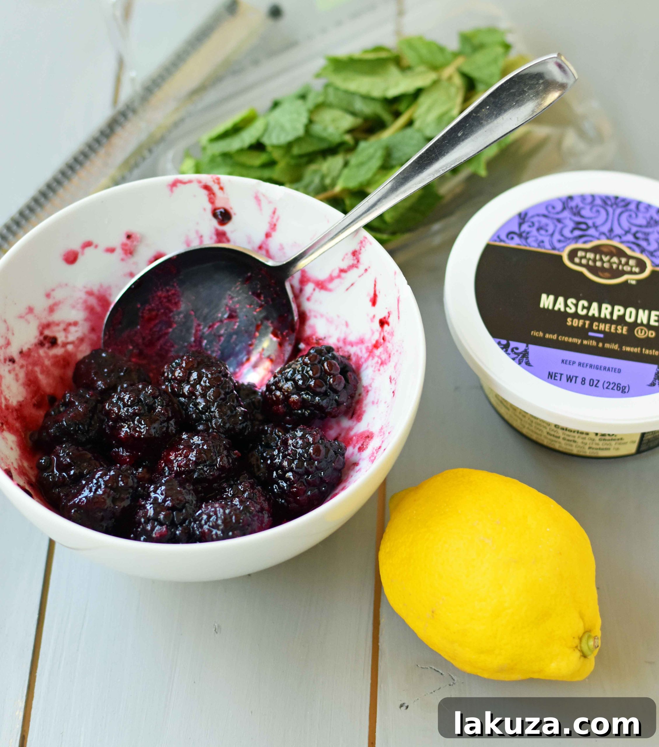 Blackberry and Lemon Mascarpone Crostini. A beautiful appetizer for a bridal shower, baby shower, party, festive holiday party, social gathering or for a dinner at home. A toasted baguette covered in creamy mascarpone cheese and topped with sugar marinated blackberries, fresh lemon zest, and a drizzle of honey. A sophisticated yet delicious appetizer. Learn how to make it now!