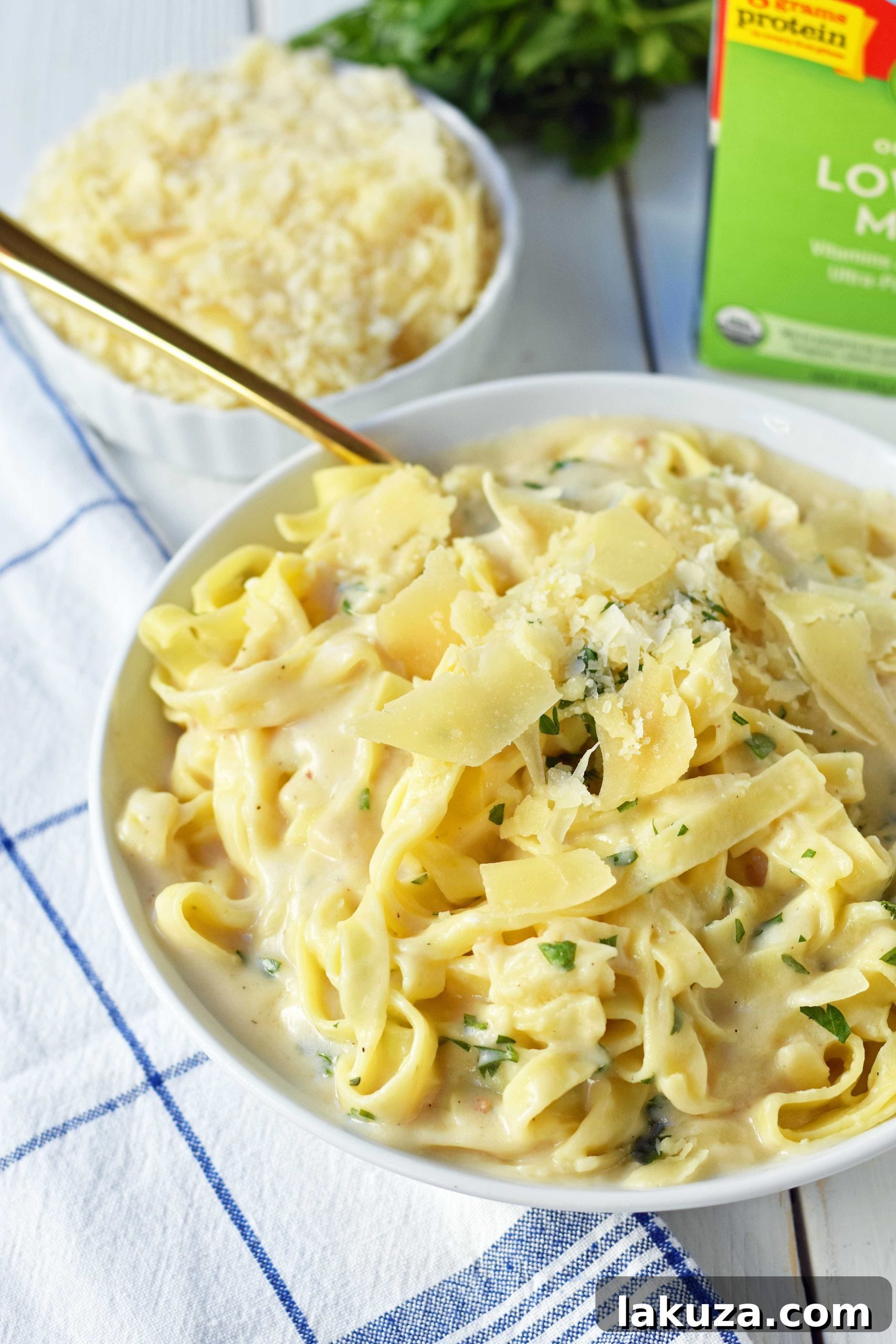 Guiltless Alfredo Indulgence 3 Skinny Fettuccine Alfredo is a low-fat version of America's favorite pasta dish. Rich and creamy fettuccine alfredo without all of the fat. This skinny fettuccine alfredo sauce is made with milk instead of heavy cream and has all of the flavor as the original. A 30-minute healthy meal that kids love. www.modernhoney.com