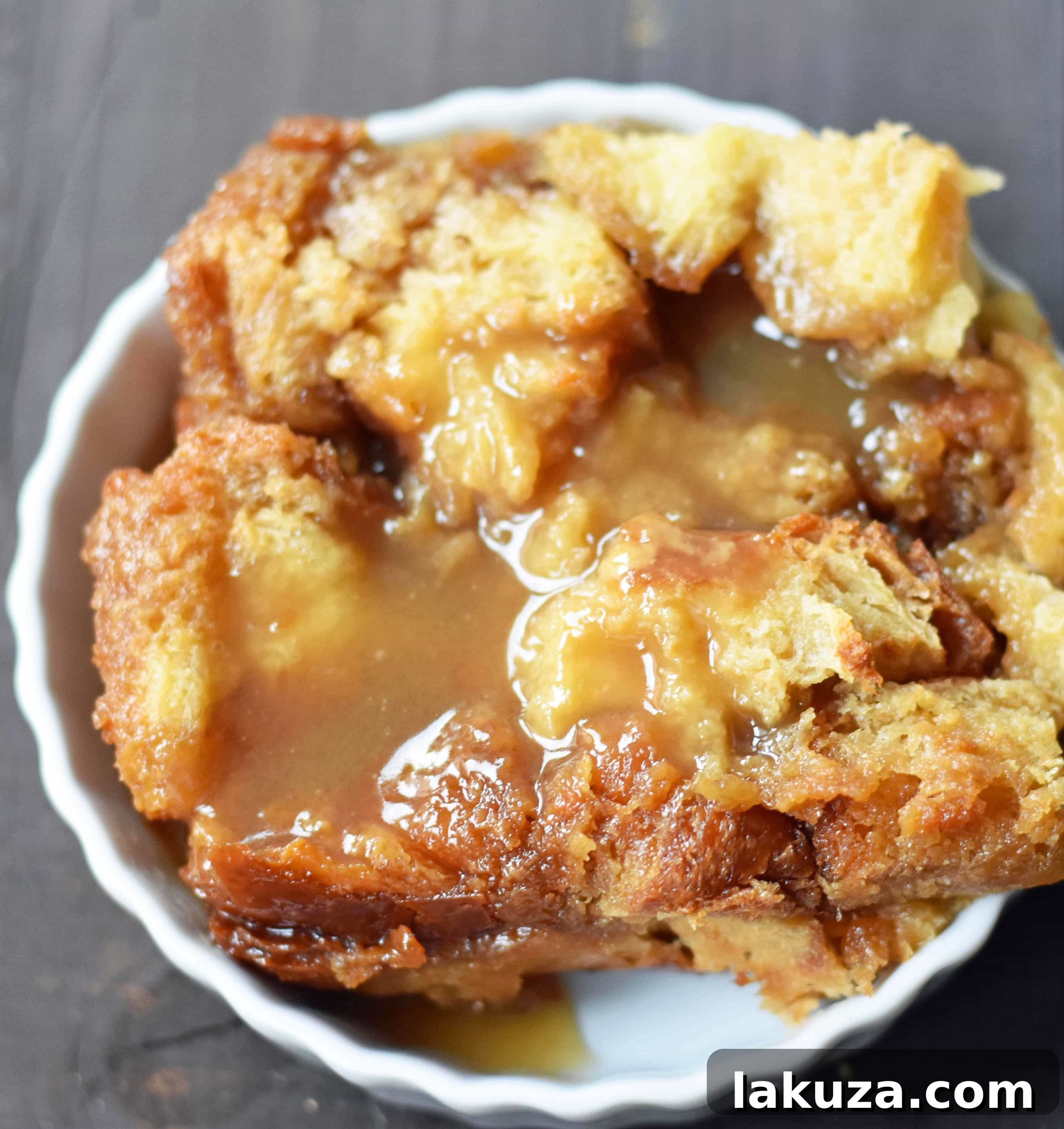 Salted Caramel Bread Pudding Delight 3 Close-up of a serving of Salted Caramel Bread Pudding, showcasing its soft texture and generous caramel topping.