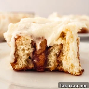 Hayley's Famous Cinnamon Rolls with creamy white frosting, warm and soft for a delightful treat.