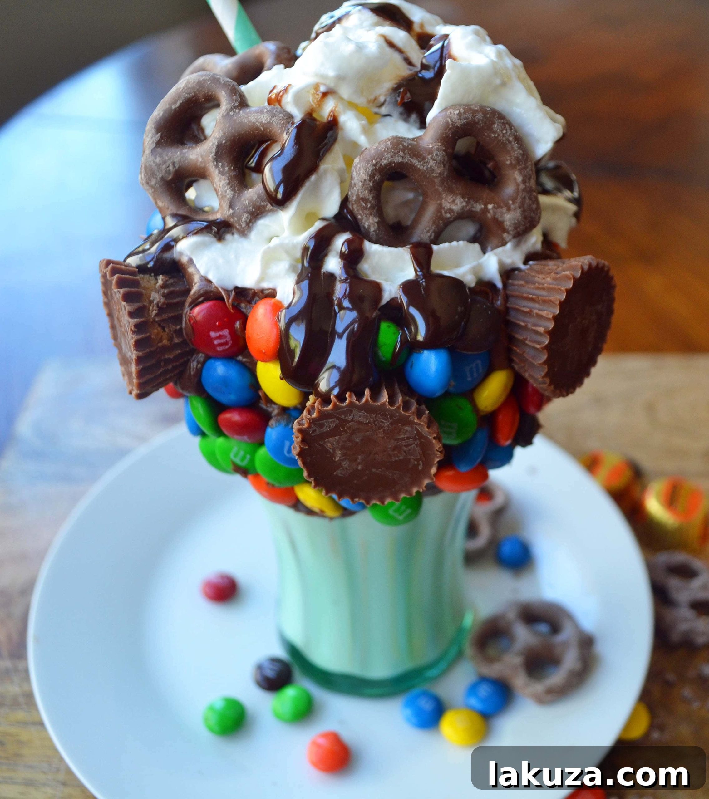 Recreate Black Tap's Jaw-Dropping Milkshakes 11 A child enjoys a homemade Black Tap copycat milkshake, highlighting the fun and appeal of these over-the-top treats.