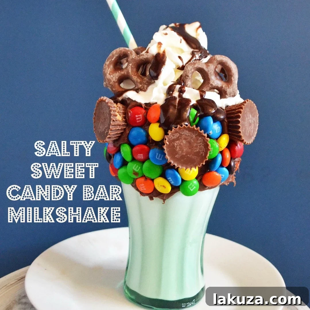 Recreate Black Tap's Jaw-Dropping Milkshakes 8 A finished Black Tap copycat milkshake, extravagantly topped with sauces, candies, and a colorful straw, ready for enjoyment.