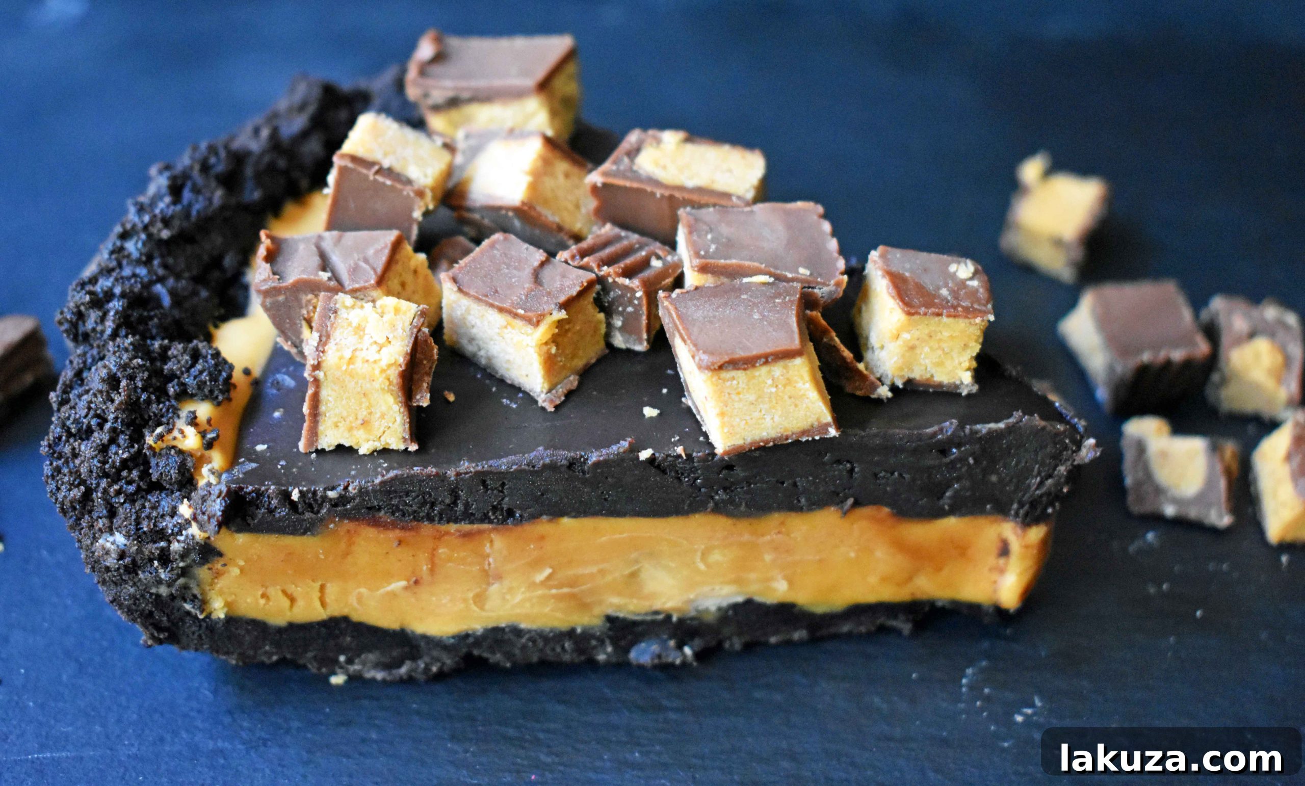 Overhead view of a ready-to-serve Reese's Chocolate Peanut Butter Cup Pie, garnished with extra peanut butter cups.