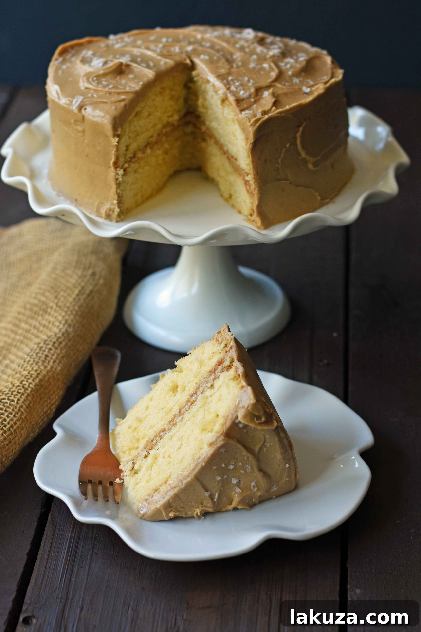 Southern Caramel Cake with Salted Caramel Frosting. A moist and fluffy yellow cake with sea salt caramel frosting. A Southern favorite cake! www.modernhoney.com