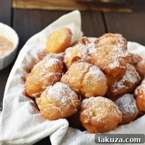 How to make quick and easy homemade apple fritters from scratch. A simple apple batter fried in oil and topped with powdered sugar, cinnamon sugar, or vanilla glaze. Can be dipped in homemade creme anglaise or pastry cream. A festive Fall dessert. www.modernhoney.com