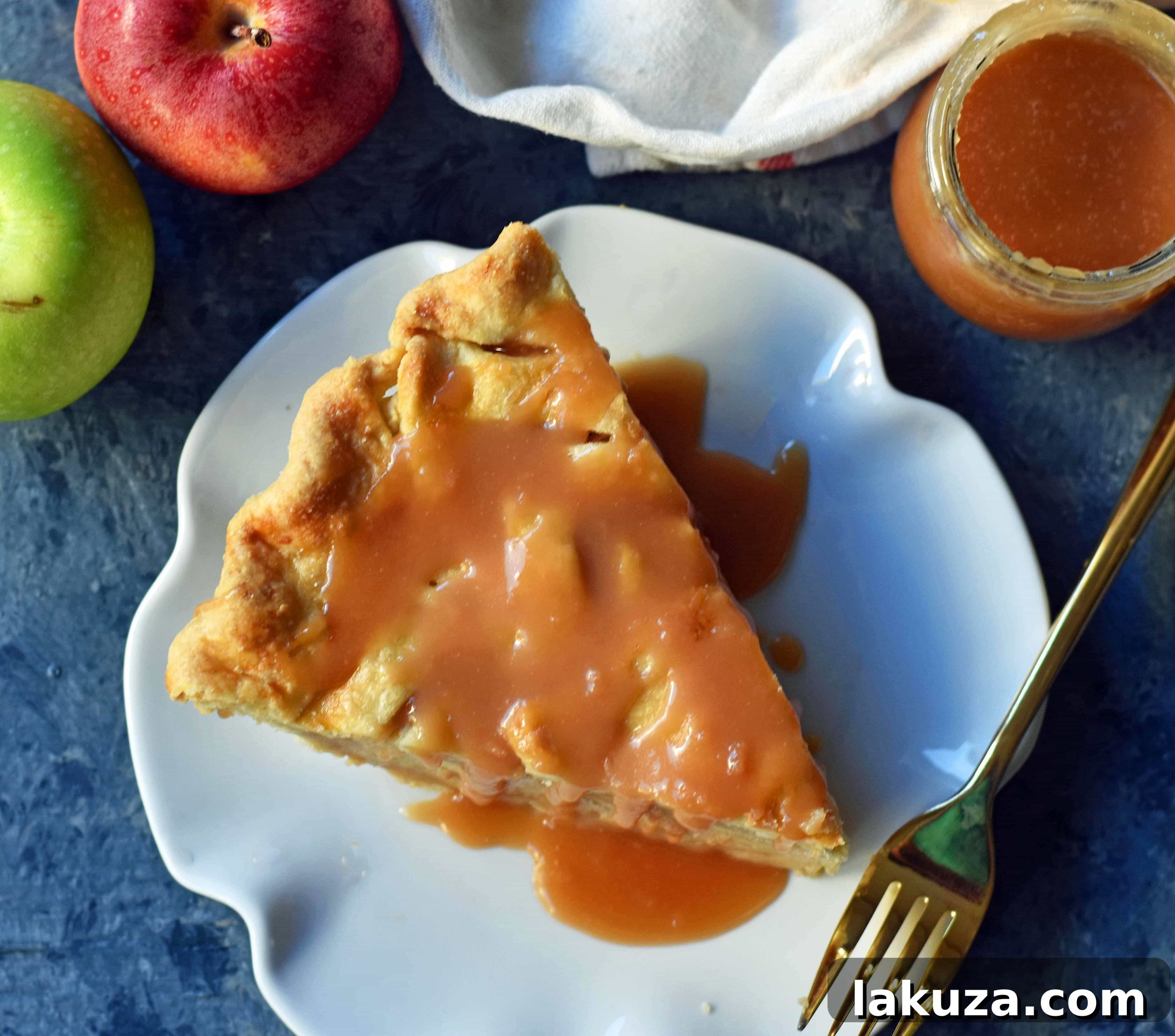 Golden-brown salted caramel apple pie, fresh from the oven, showcasing a flaky crust and rich filling, perfect for any occasion.