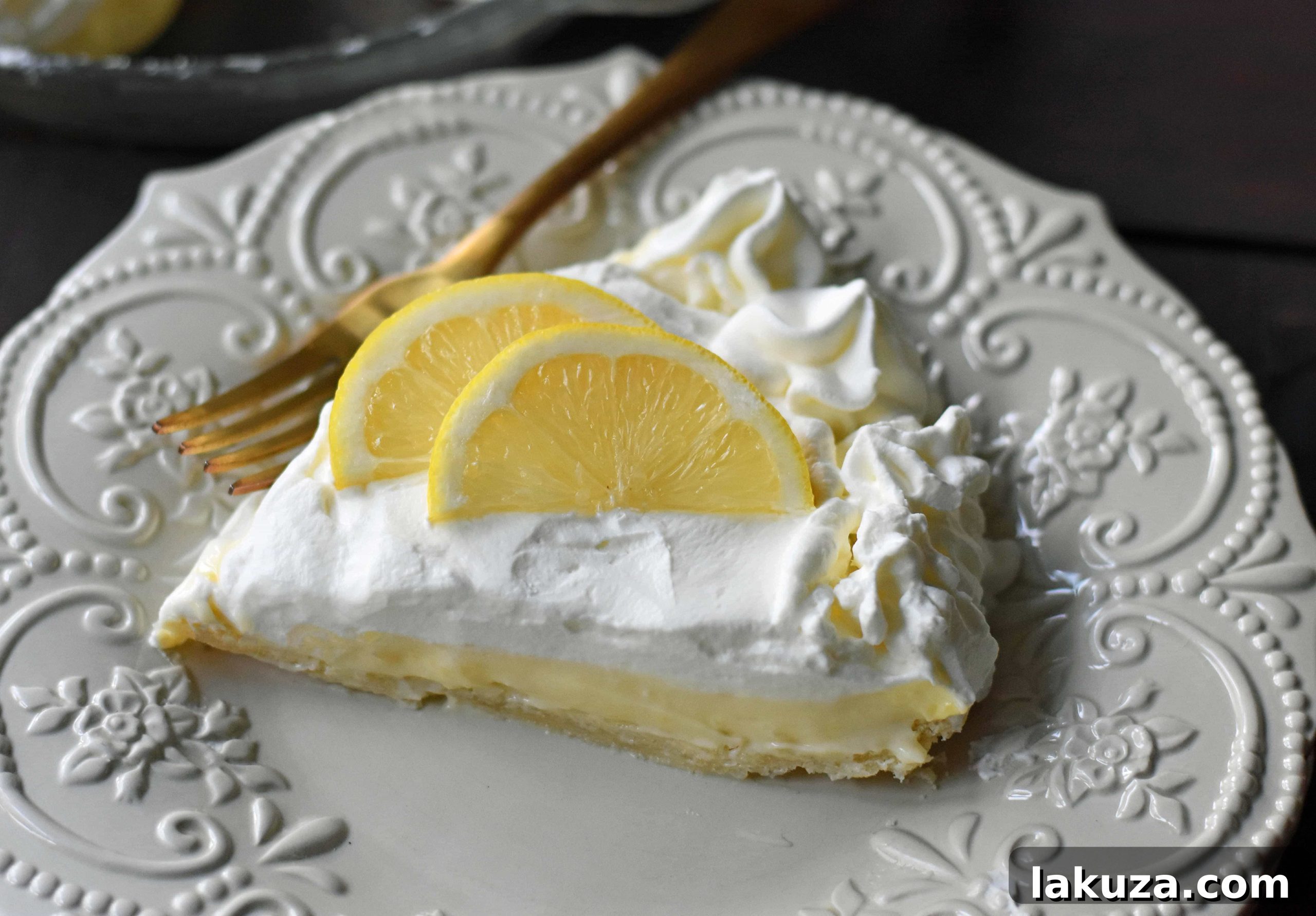 Close-up of a whole Sweet Lemon Sour Cream Pie, showcasing its golden crust and creamy texture, ready to be sliced