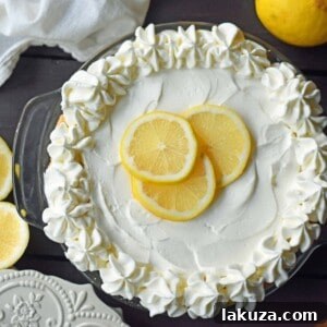 Sweet Lemon Sour Cream Pie with whipped cream topping, ready to serve
