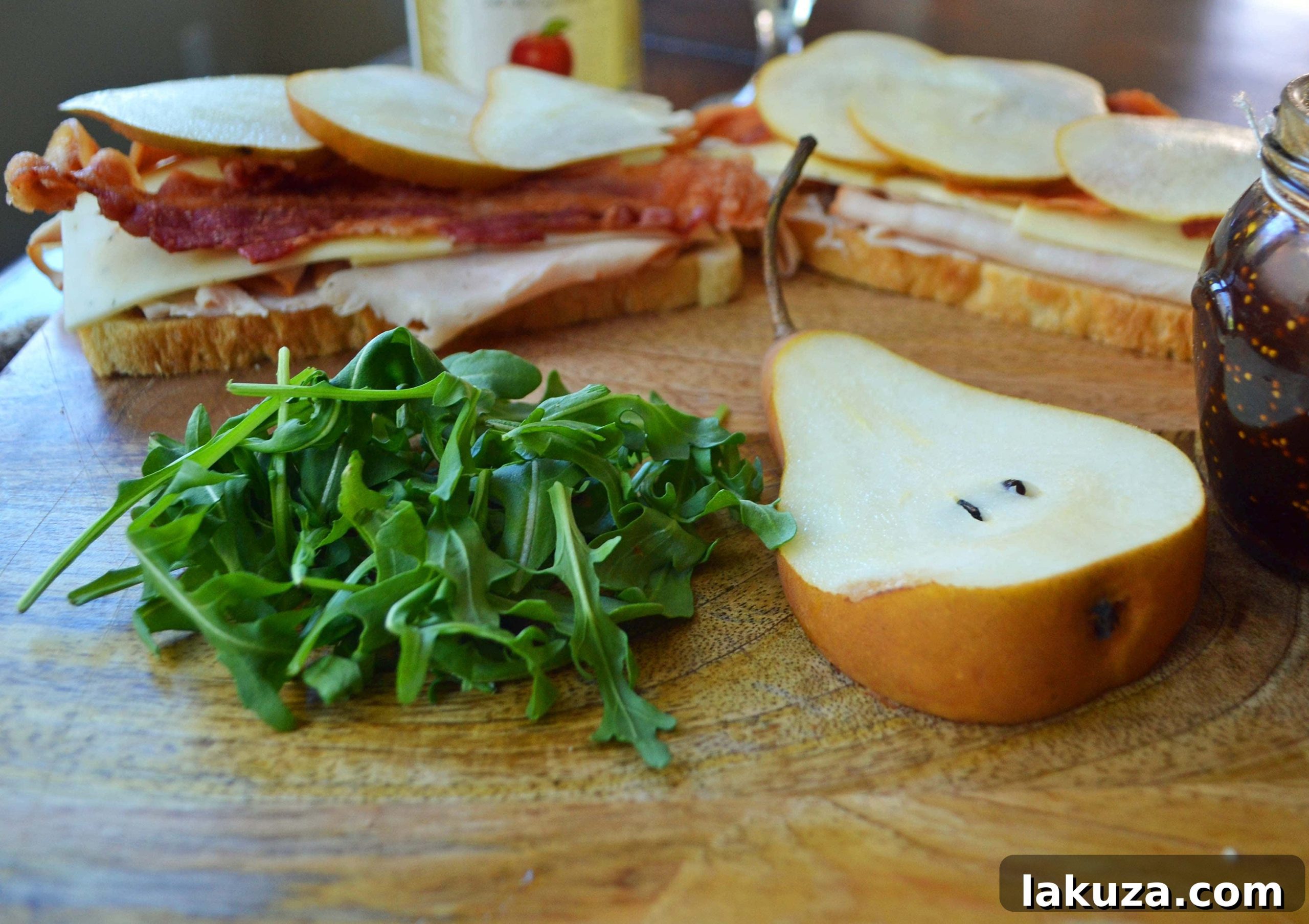 Stacked halves of a Turkey Bacon Panini, showcasing its delicious layers