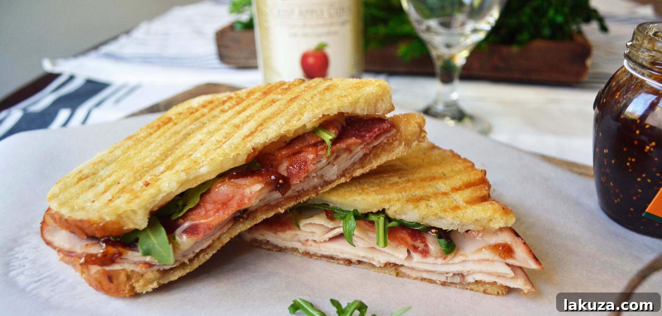 An inviting close-up of the Fig Jam Turkey Bacon Panini, ready to be enjoyed