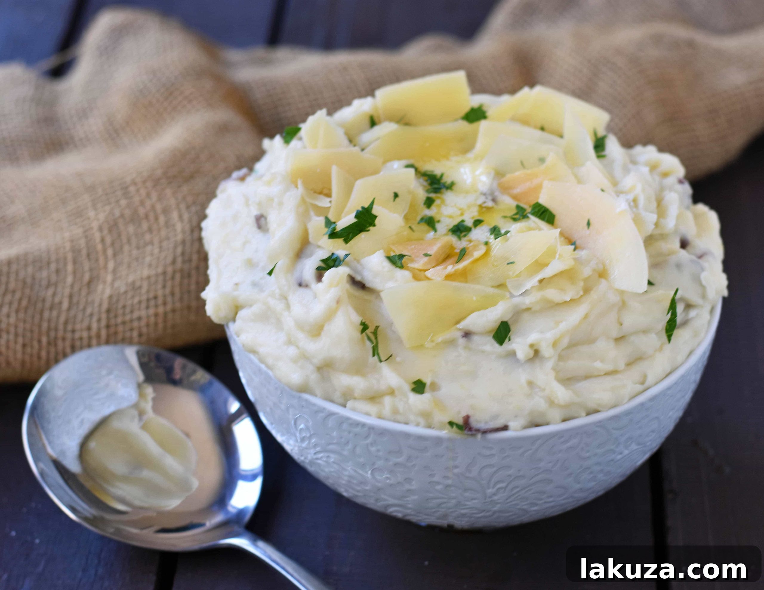 Creamy Parmesan Mashed Potatoes are the perfect mashed potatoes. Rich and creamy potatoes with butter, half-n-half, sour cream, and parmesan cheese. The most flavorful and creamy mashed potatoes! A popular side dish. www.modernhoney.com