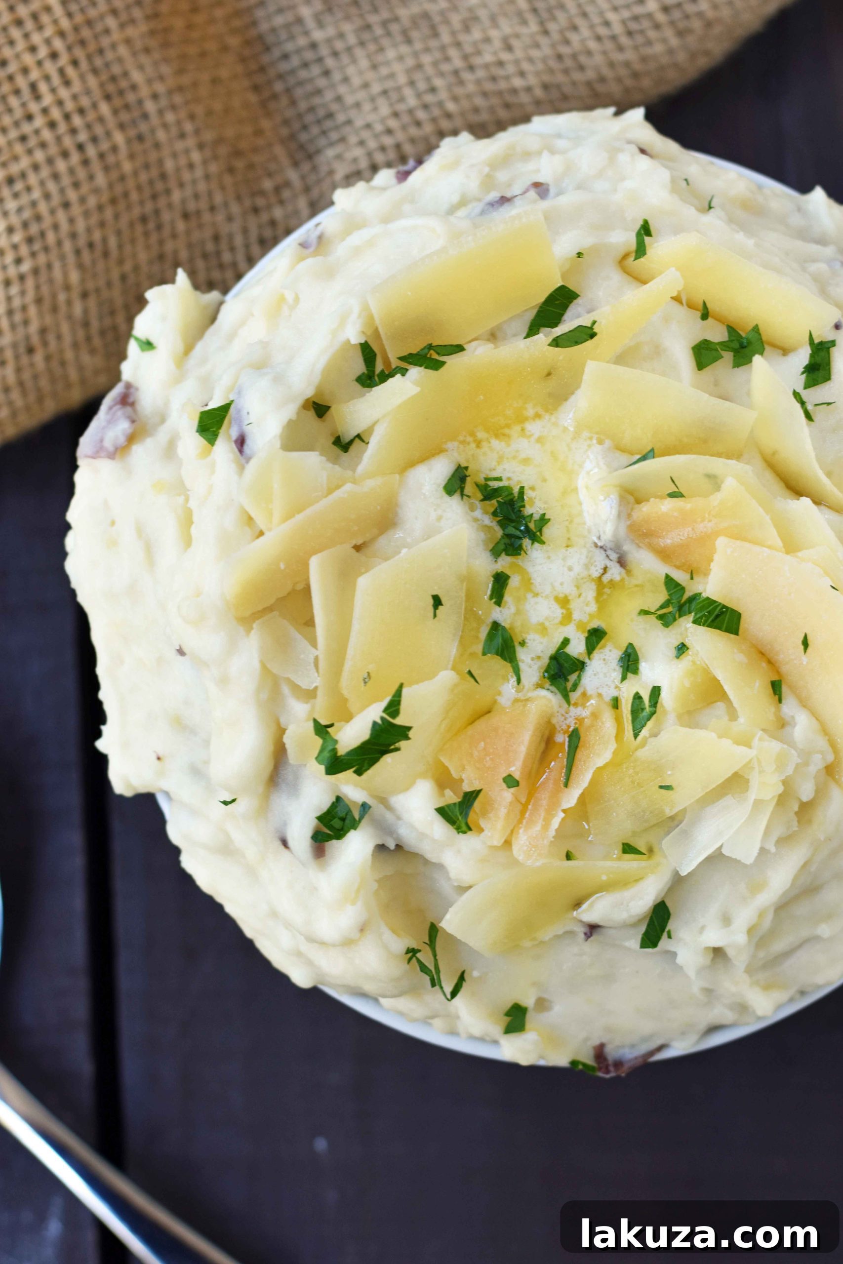 Creamy Parmesan Mashed Potatoes are the perfect mashed potatoes. Rich and creamy potatoes with butter, half-n-half, sour cream, and parmesan cheese. The most flavorful and creamy mashed potatoes! A popular side dish. www.modernhoney.com