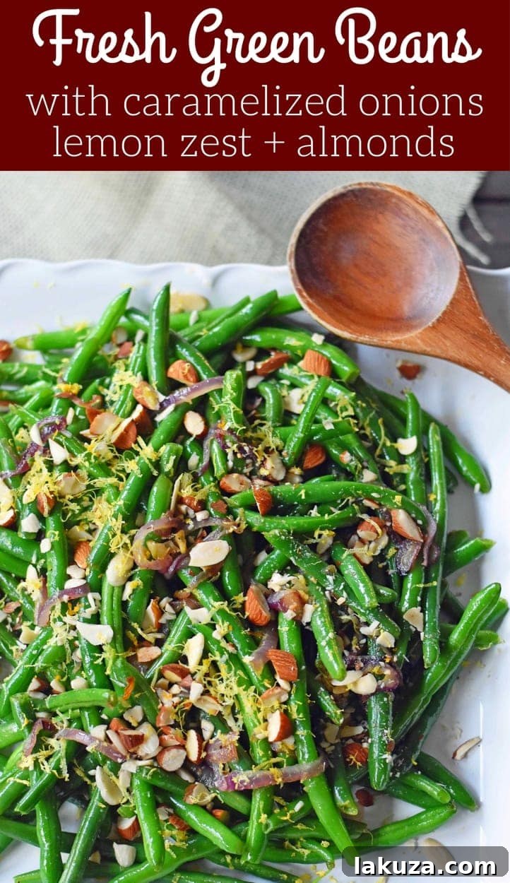 A vibrant and healthy serving of Green Beans Almondine, expertly prepared with caramelized onions, lemon zest, and crunchy almonds, perfect for a festive table.