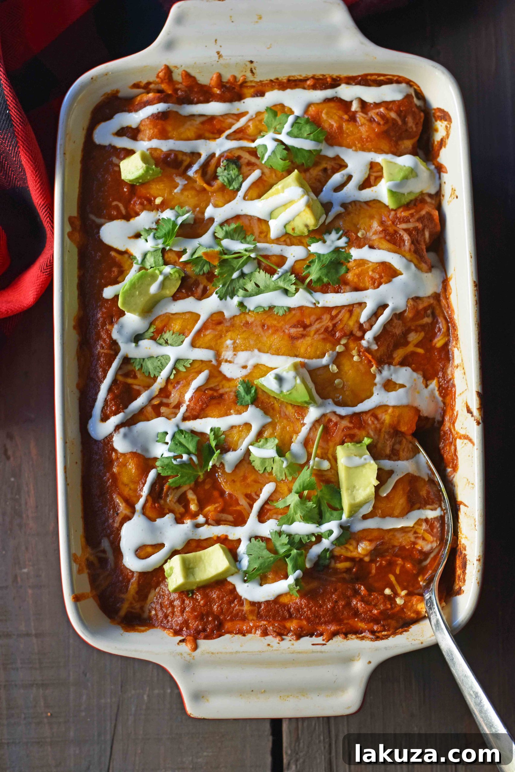 Red Chile Chicken Enchiladas with homemade red enchilada sauce. How to make enchilada sauce from scratch. The best red chicken and cheese enchiladas with a side of garnishes.