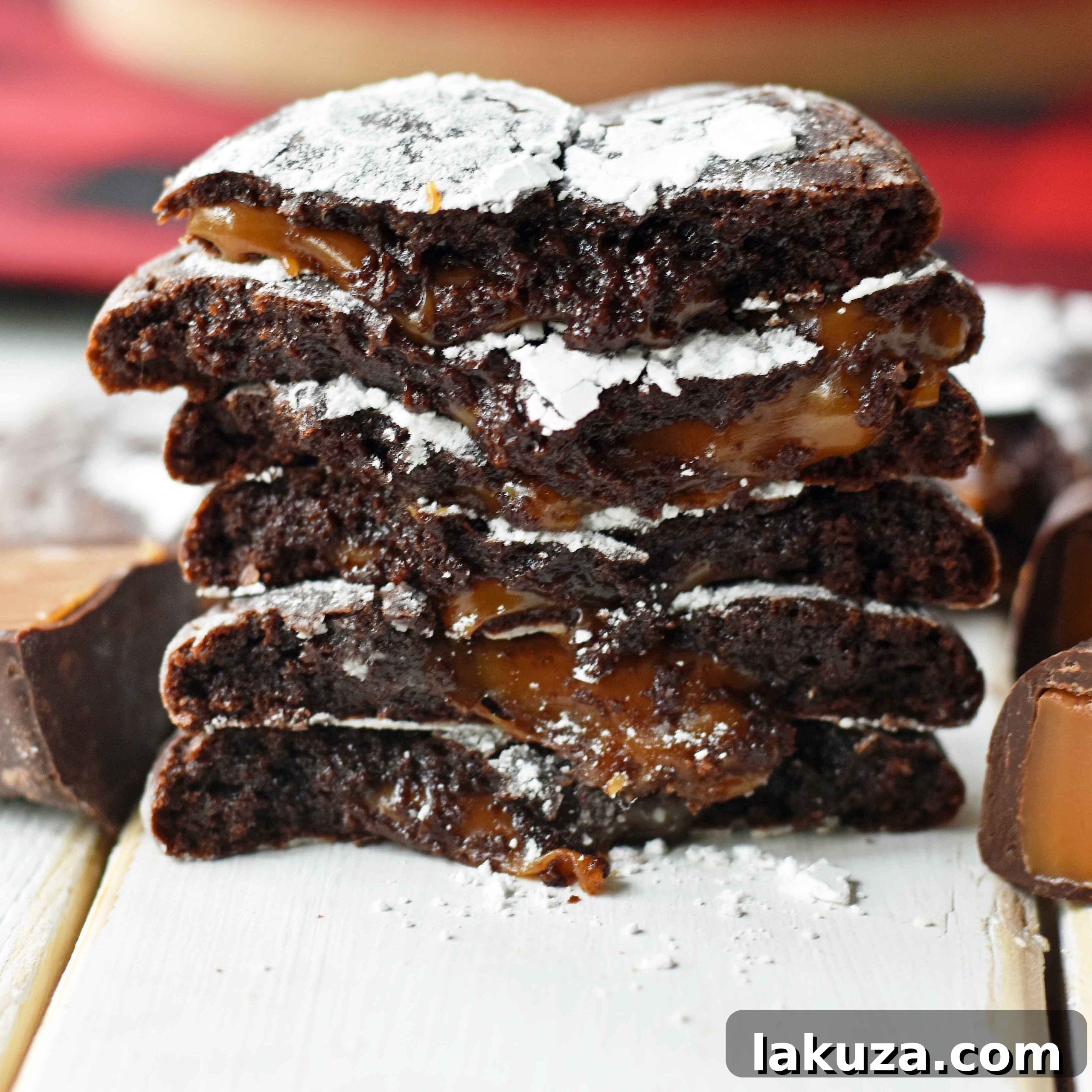 Molten Caramel Chocolate Crinkles 2 Caramel Filled Chocolate Crinkle Cookies. Soft chewy chocolate cookies with soft caramel center and roll into powdered sugar. A popular chocolate caramel filled cookie. www.modernhoney.com