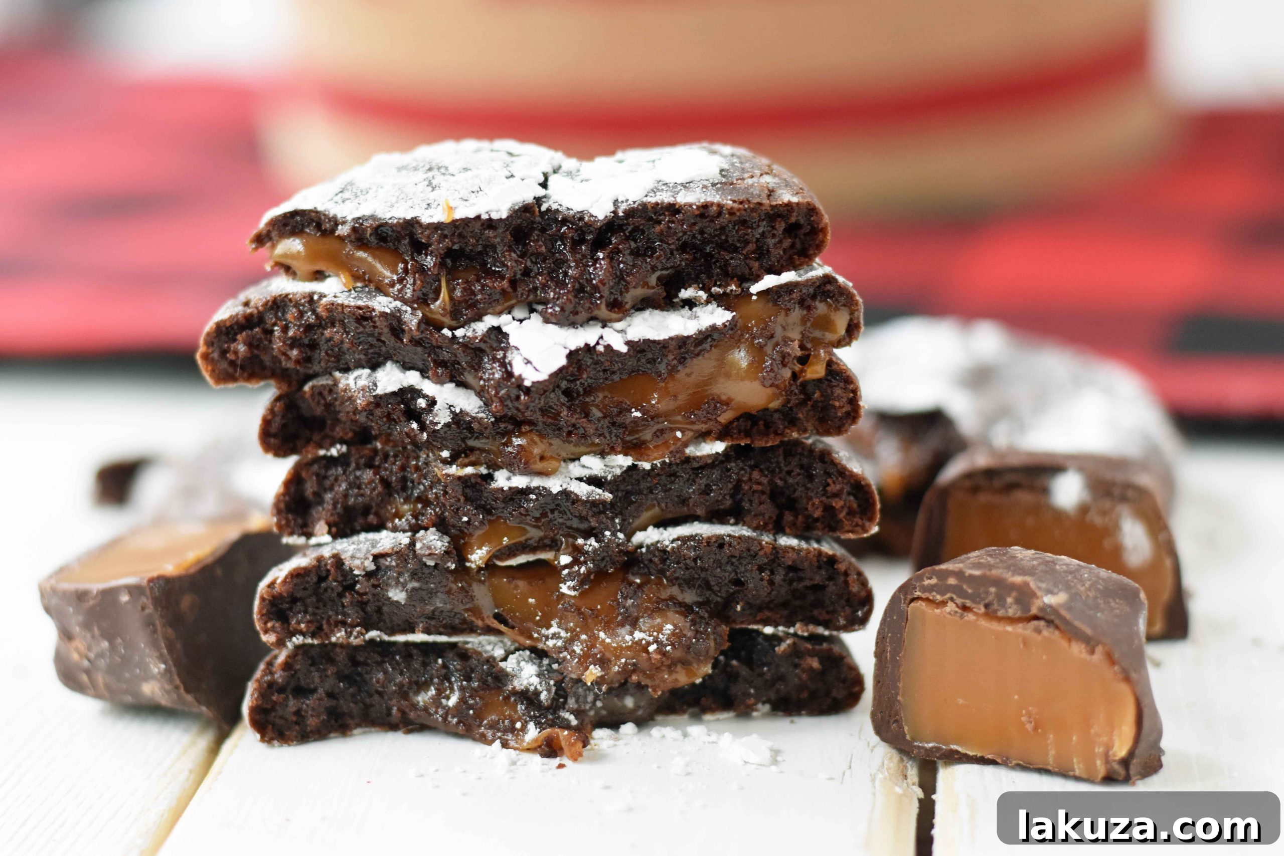 Molten Caramel Chocolate Crinkles 4 Caramel Filled Chocolate Crinkle Cookies. Soft chewy chocolate cookies with soft caramel center and roll into powdered sugar. A popular chocolate caramel filled cookie. www.modernhoney.com