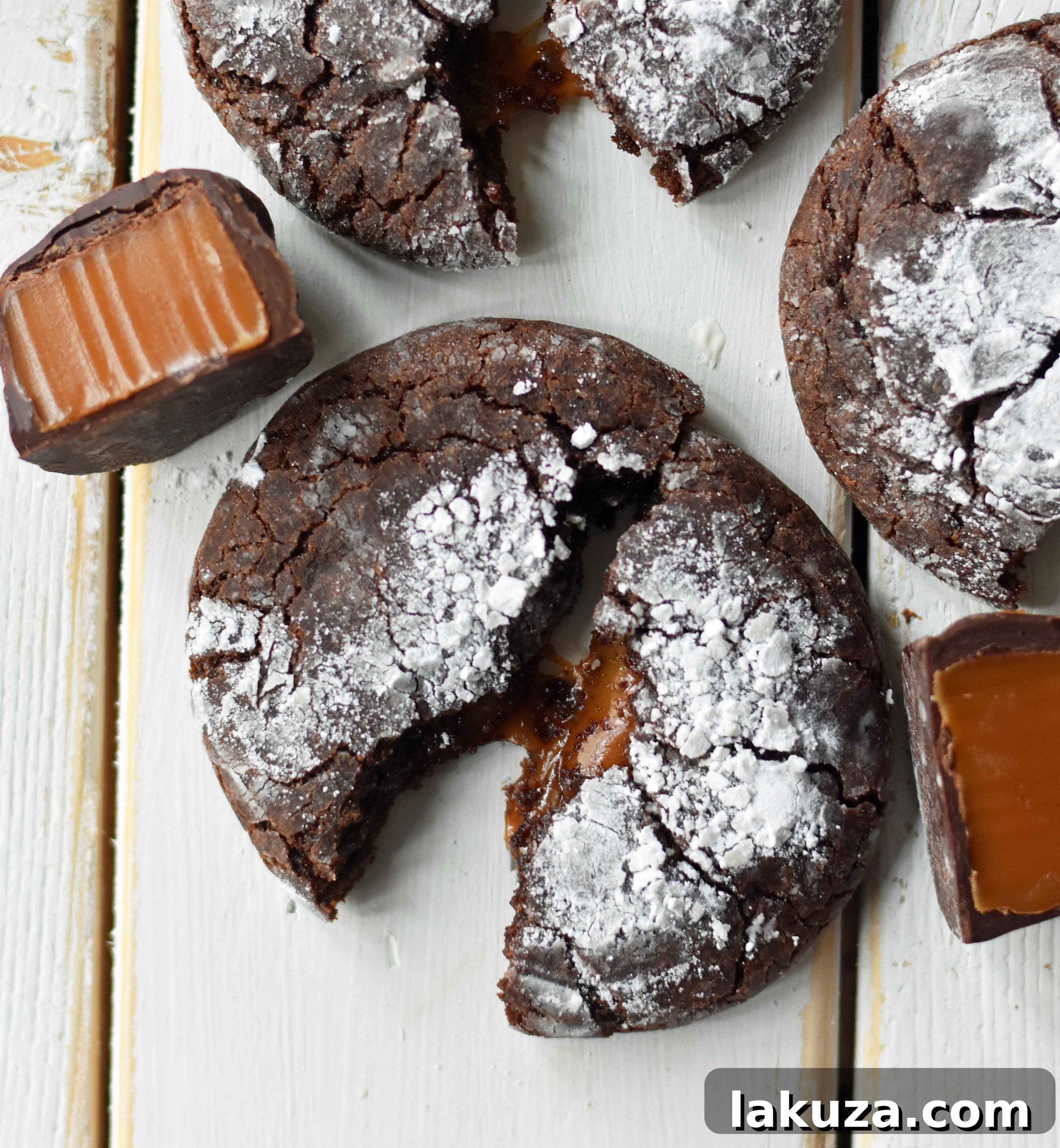 Molten Caramel Chocolate Crinkles 5 Caramel Filled Chocolate Crinkle Cookies. Soft chewy chocolate cookies with soft caramel center and roll into powdered sugar. A popular chocolate caramel filled cookie. www.modernhoney.com