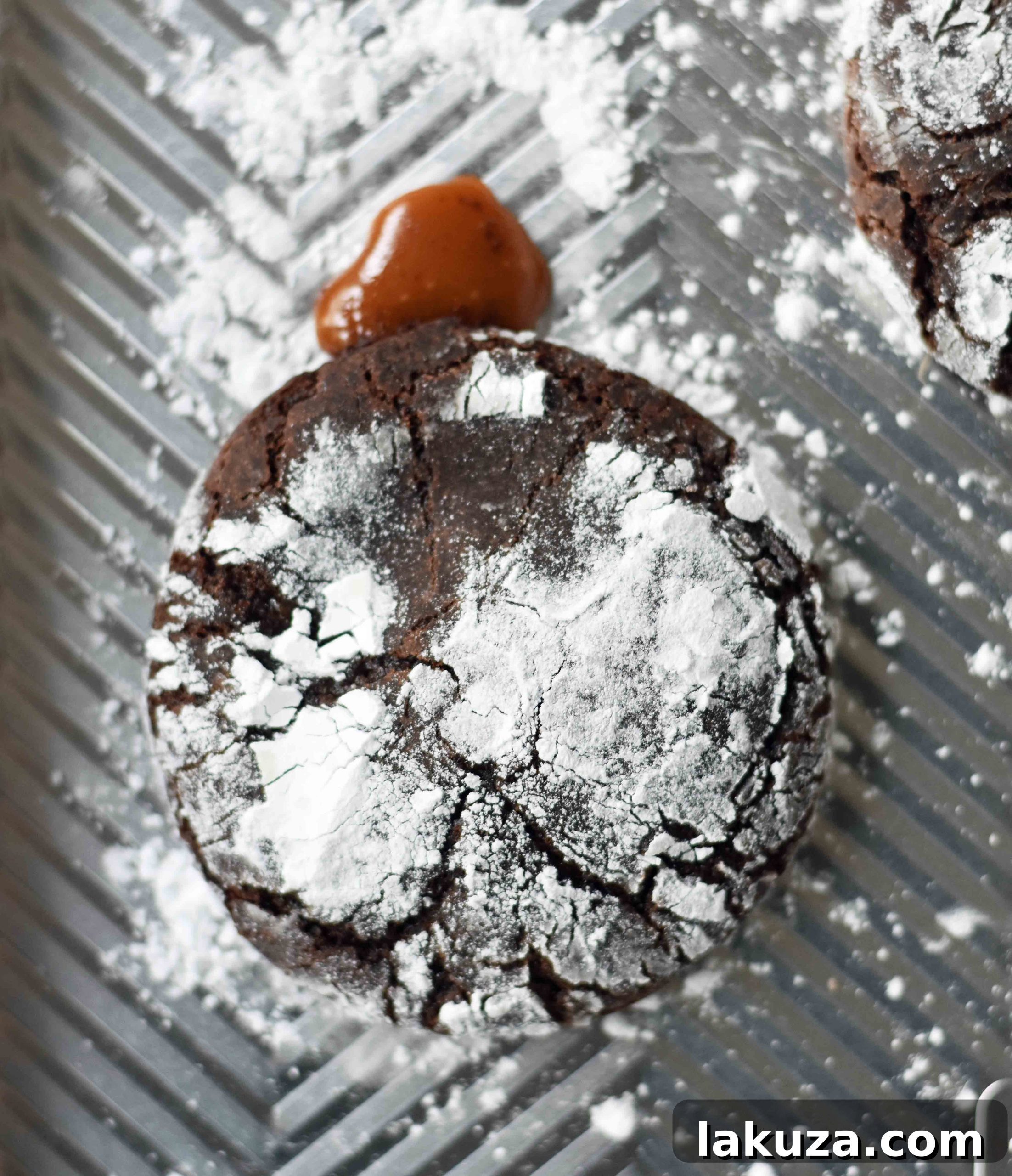 Molten Caramel Chocolate Crinkles 6 Caramel Filled Chocolate Crinkle Cookies. Soft chewy chocolate cookies with soft caramel center and roll into powdered sugar. A popular chocolate caramel filled cookie. www.modernhoney.com