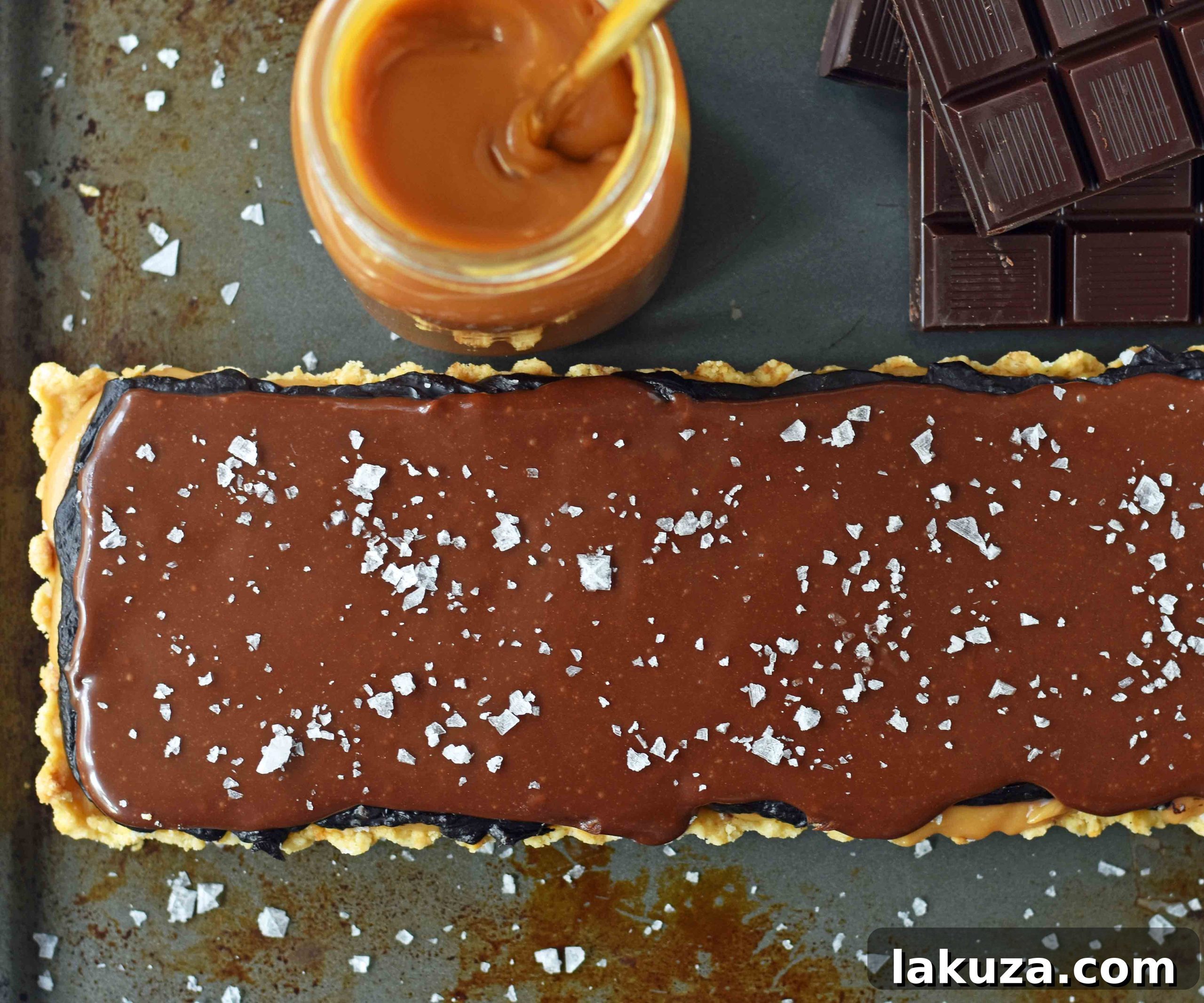 Decadent Chocolate Caramel Bars 3 Chocolate Caramel Slice is a dessert with a buttery shortbread crust, creamy handcrafted caramel, and a silky smooth chocolate glaze. A gourmet Twix candy bar! www.modernhoney.com