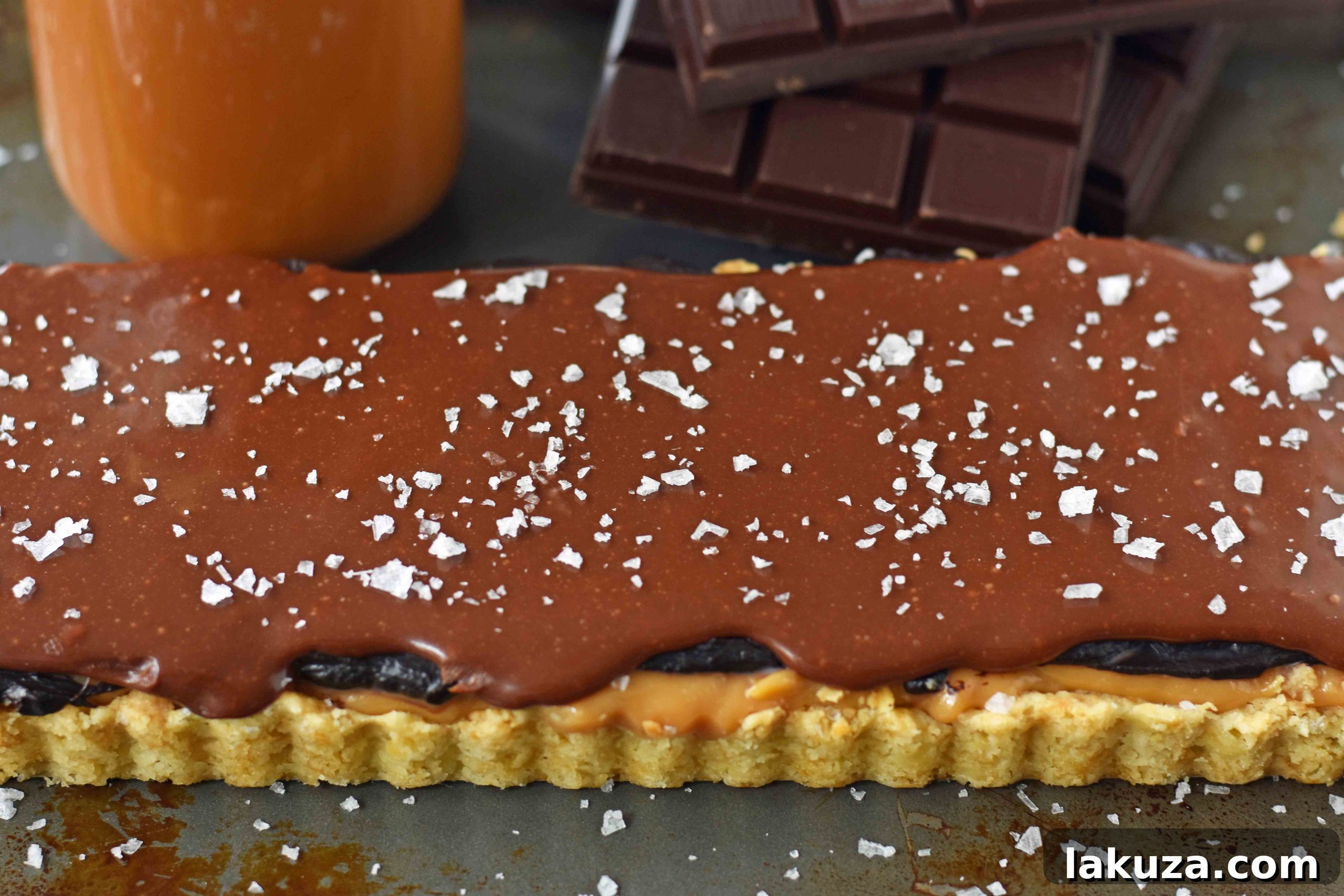Decadent Chocolate Caramel Bars 5 Chocolate Caramel Slice is a dessert with a buttery shortbread crust, creamy handcrafted caramel, and a silky smooth chocolate glaze. A gourmet Twix candy bar! www.modernhoney.com