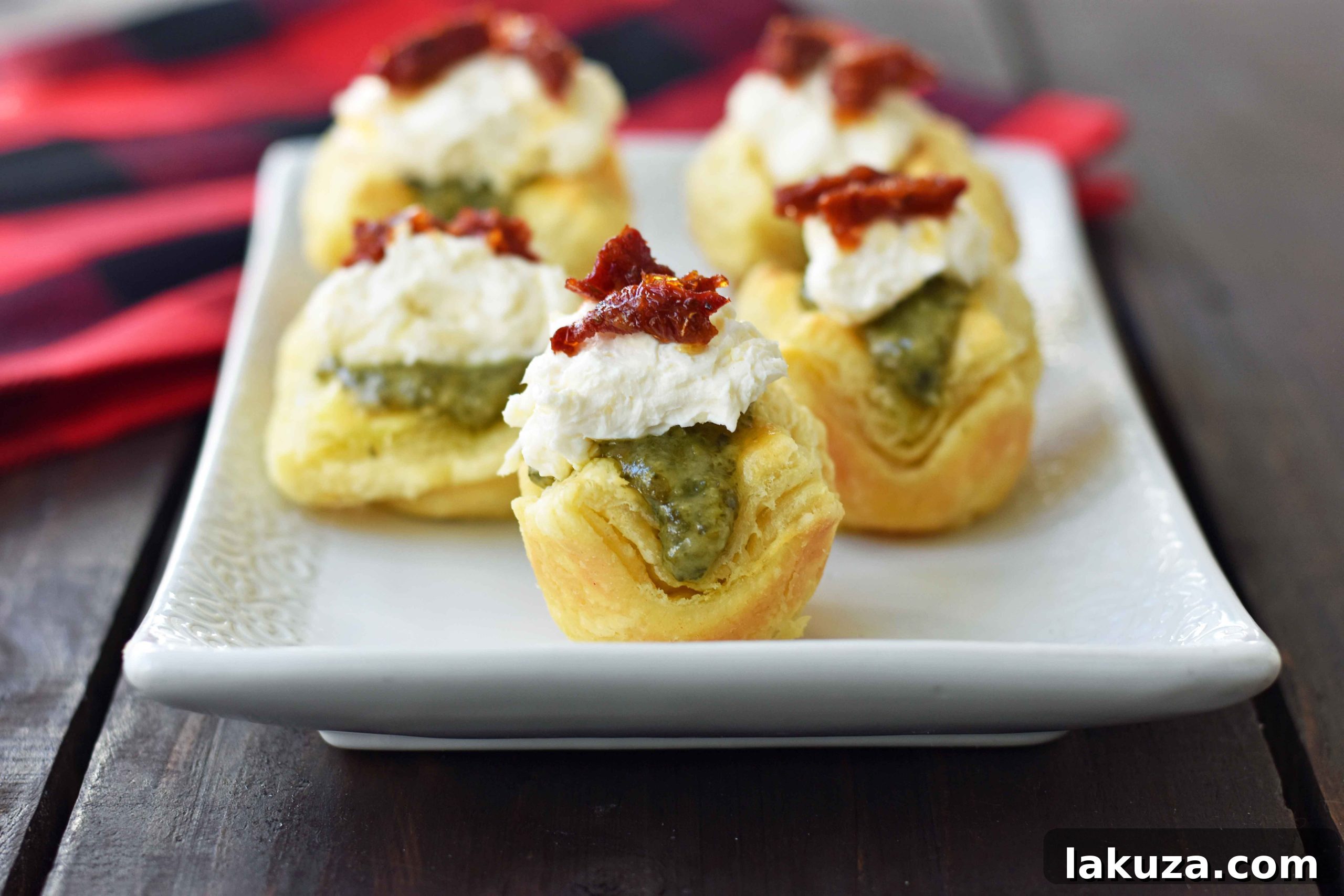 Assembled Pesto Parmesan Sundried Tomato Tartlets ready for serving, showcasing their vibrant colors.