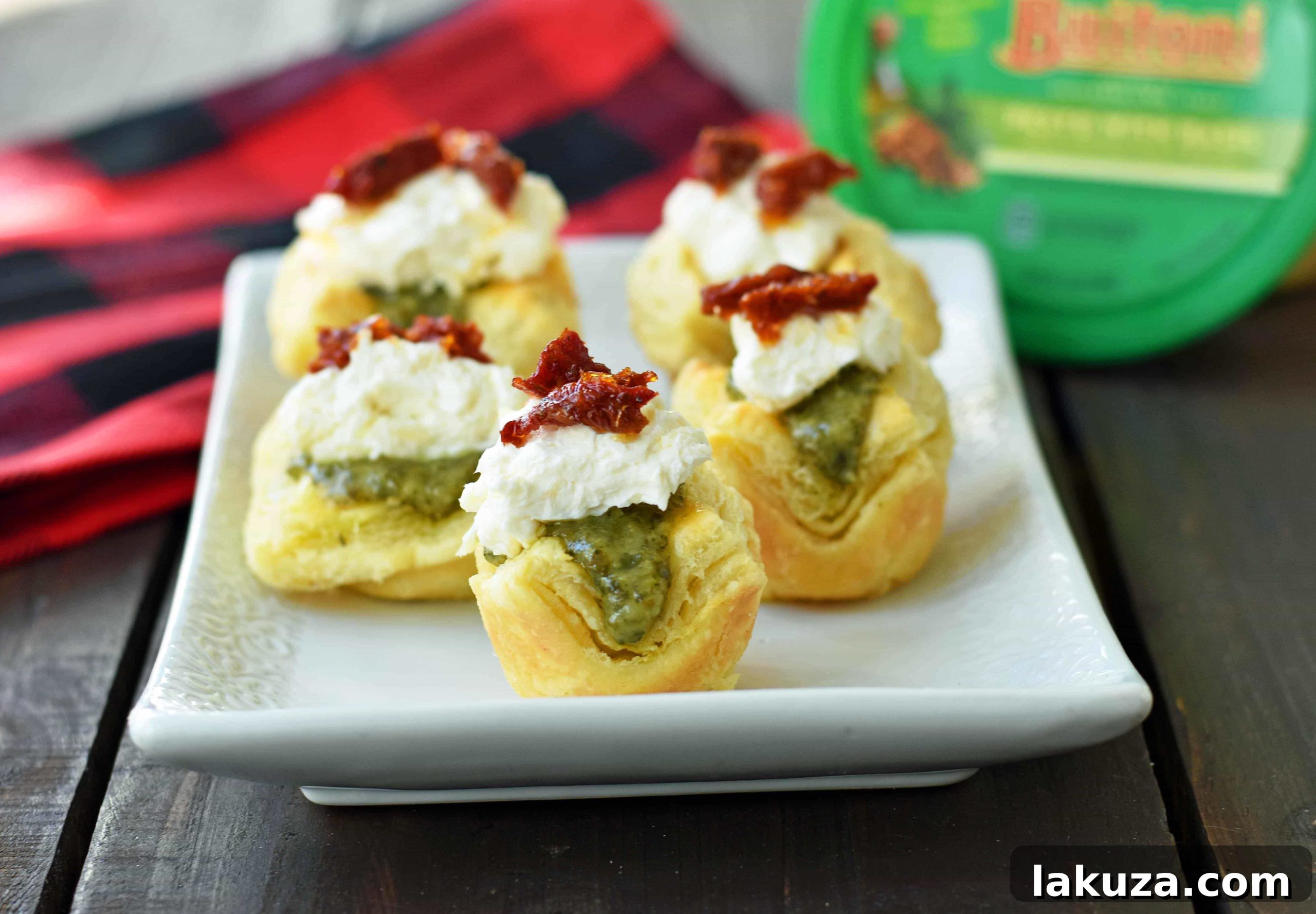Pesto Parmesan Sundried Tomato Tartlets presented beautifully, highlighting their gourmet appeal.