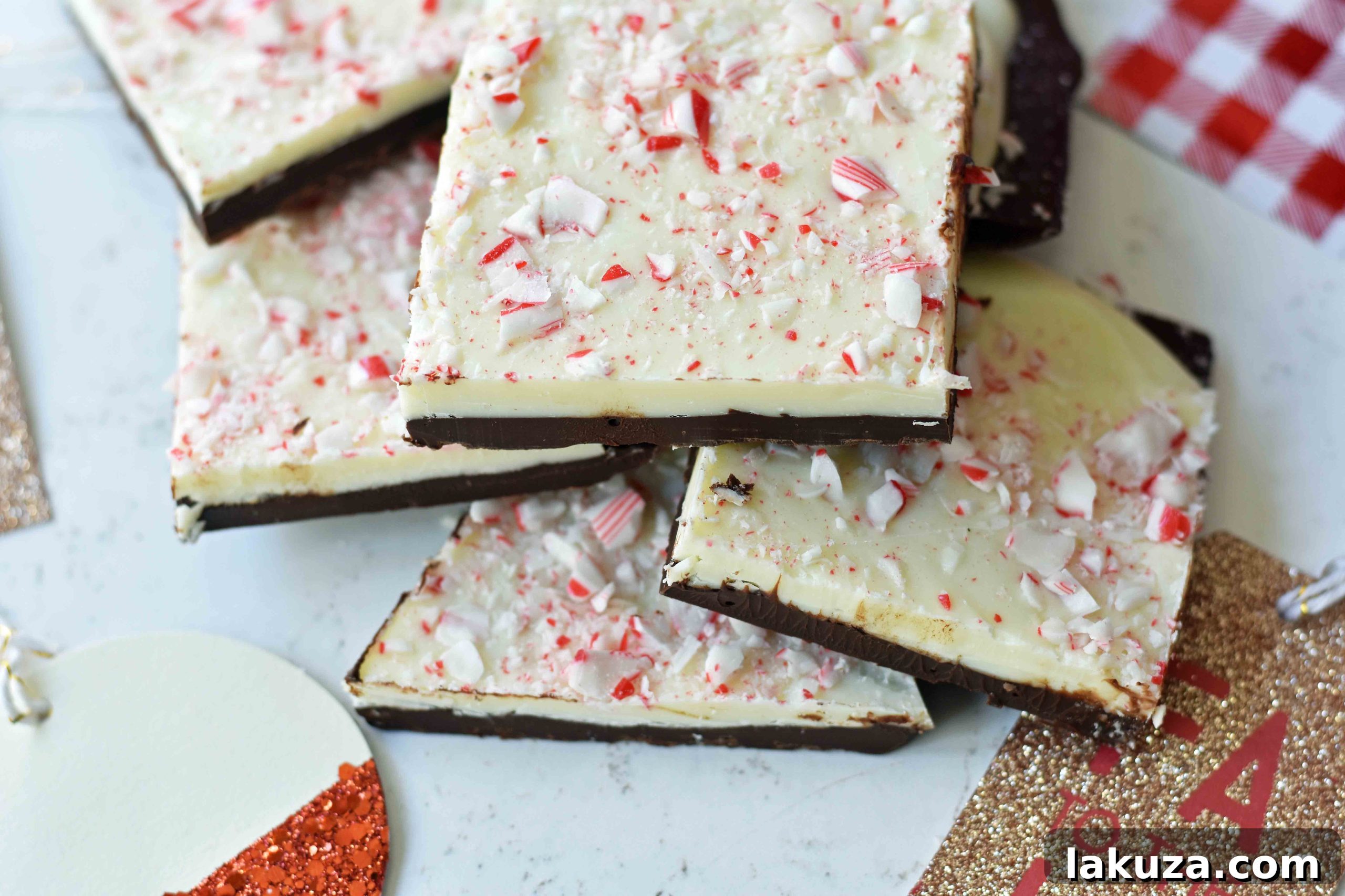 Wintermint Chocolate Crunch 4 A large slab of freshly made Chocolate Peppermint Bark, perfectly set and glistening, ready to be broken or cut into pieces, with a close-up texture of both chocolate layers and candy cane crunch.