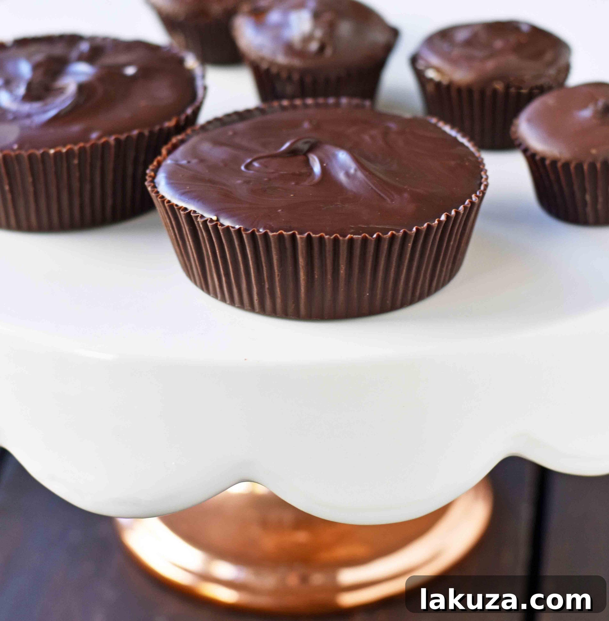 Irresistible Peanut Butter Chocolate Cups 4 Homemade Chocolate Peanut Butter Cups. How to make copycat Reese's chocolate chip peanut butter cups and copycat Trader Joe's peanut butter cups. The best homemade chocolate peanut butter cups recipe. www.modernhoney.com