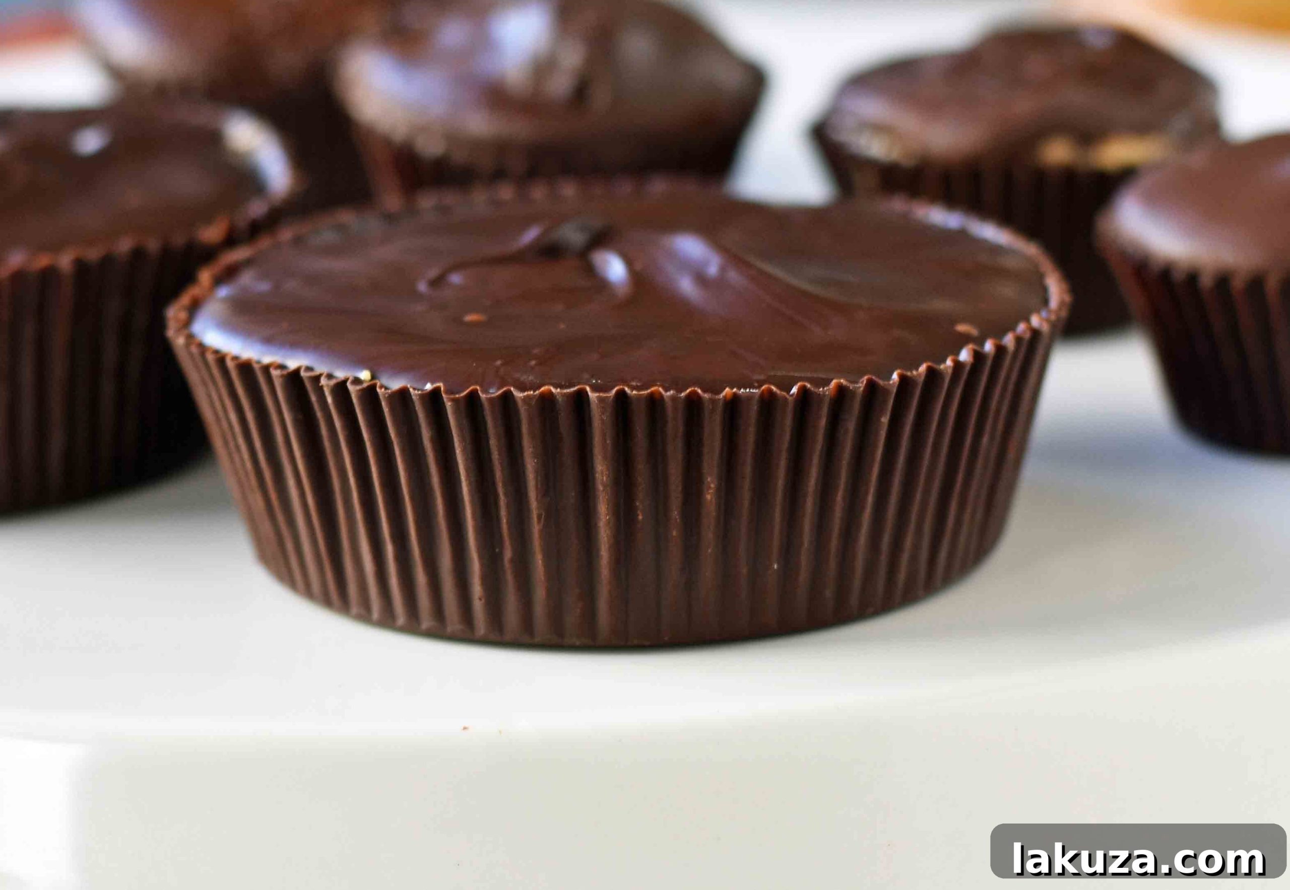 Irresistible Peanut Butter Chocolate Cups 5 Homemade Chocolate Peanut Butter Cups. How to make copycat Reese's chocolate chip peanut butter cups and copycat Trader Joe's peanut butter cups. The best homemade chocolate peanut butter cups recipe. www.modernhoney.com