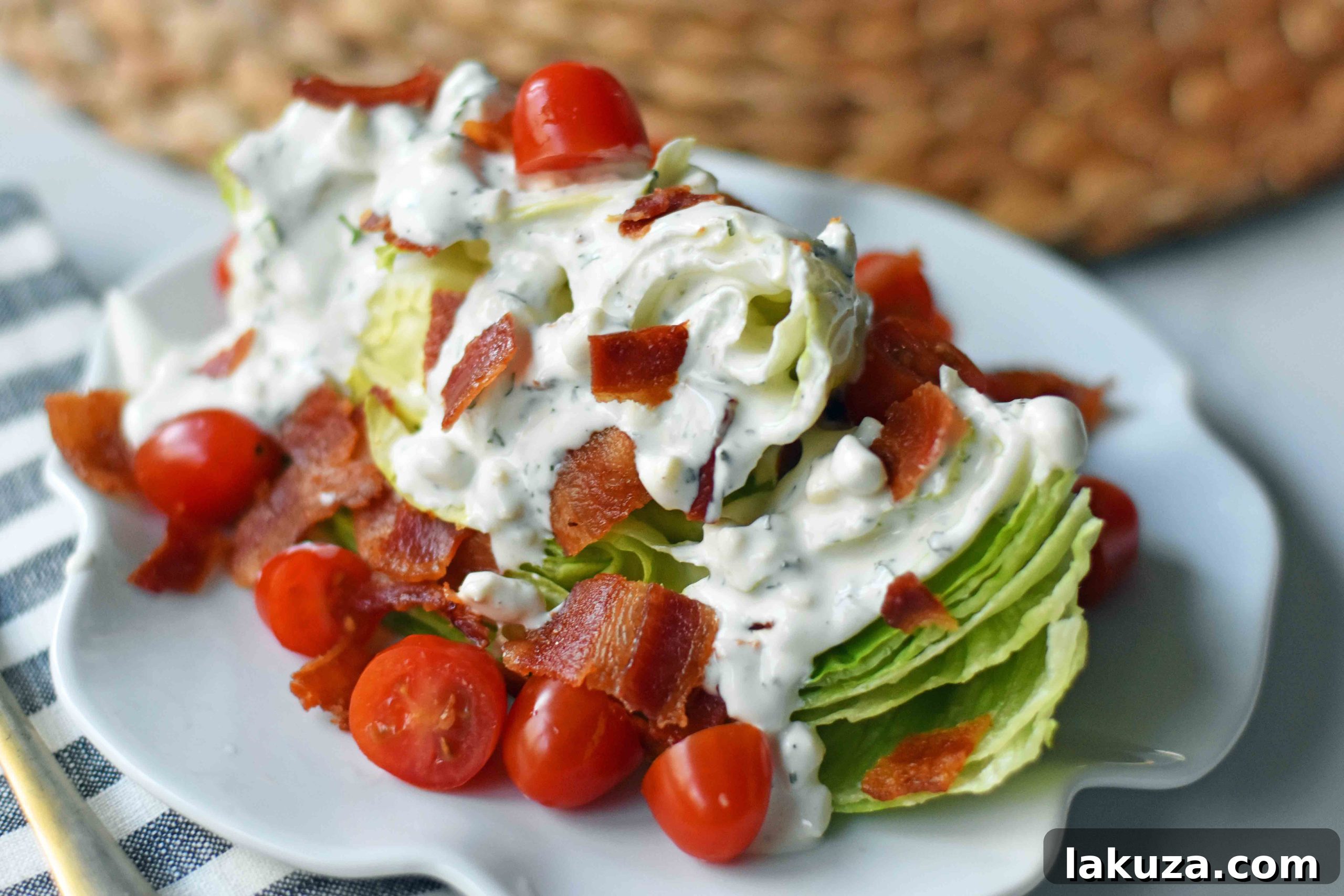 Iconic BLT Wedge 3 Crisp iceberg lettuce wedge adorned with vibrant cherry tomatoes, golden-crisp bacon, and a luxurious swirl of creamy homemade dressing, highlighted by a balsamic drizzle.