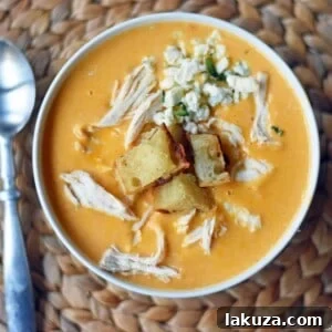 Creamy Buffalo Chicken Soup. All of the flavor of chicken wings in one soup. A tangy, creamy, and spicy buffalo chicken soup. www.modernhoney.com