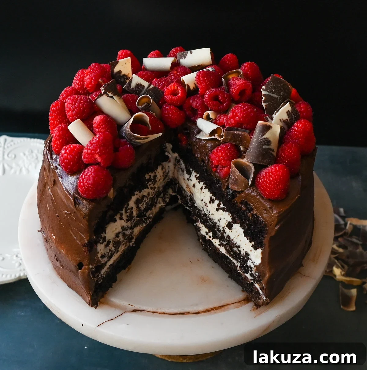 Decadent Chocolate Raspberry Delight 2 The Ultimate Chocolate Raspberry Cake: Layers of rich chocolate cake, creamy raspberry filling, chocolate buttercream, and fresh raspberries.