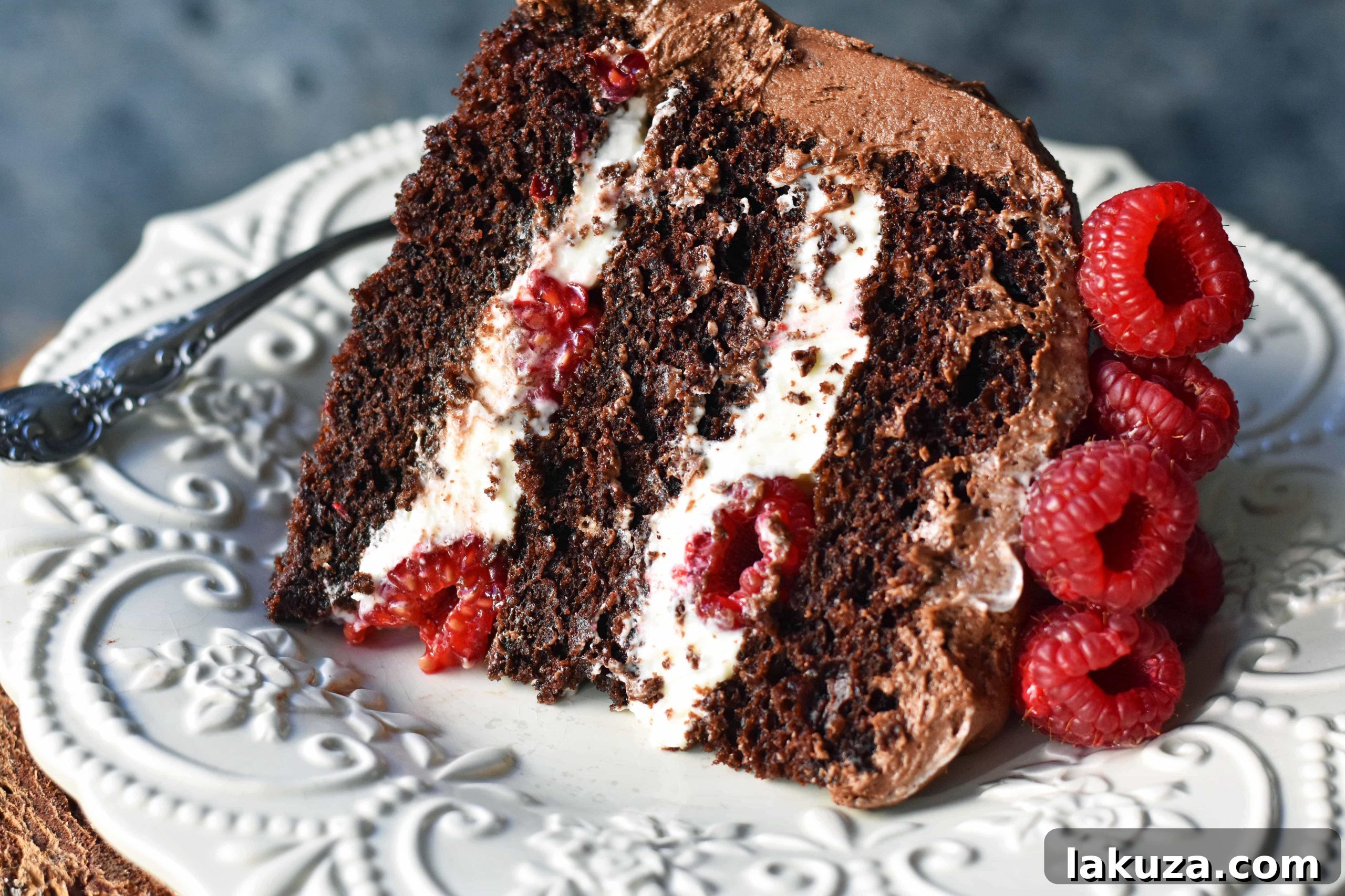Decadent Chocolate Raspberry Delight 6 A stunning Chocolate Raspberry Cake adorned with chocolate frosting and fresh berries.