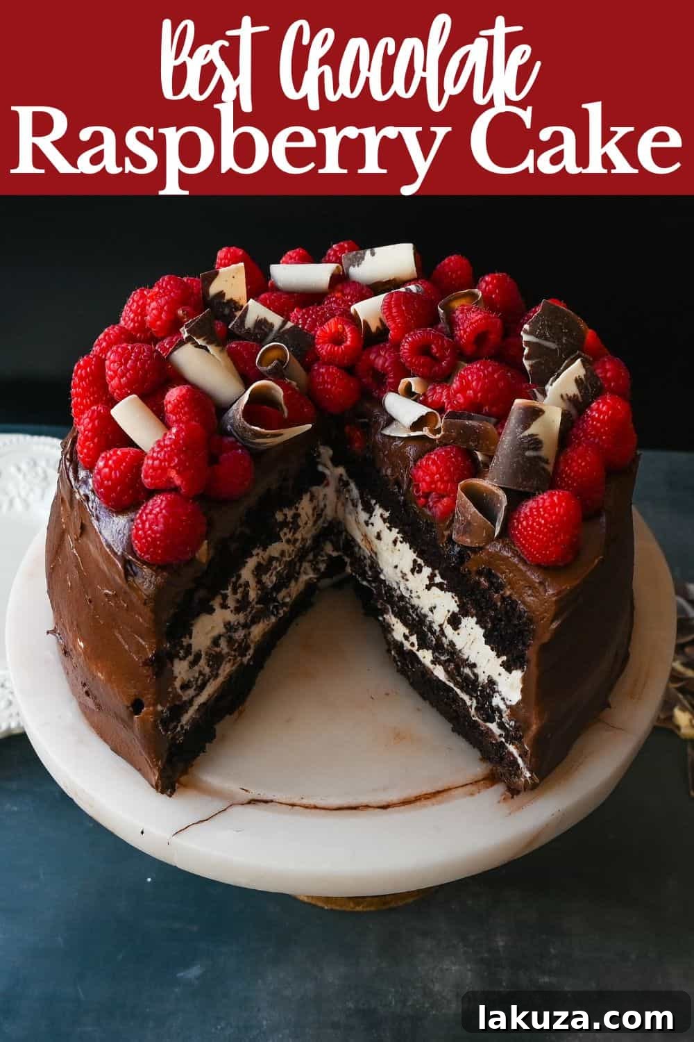 Decadent Chocolate Raspberry Delight 9 A stunning tall slice of Chocolate Raspberry Cake, showcasing the layers.
