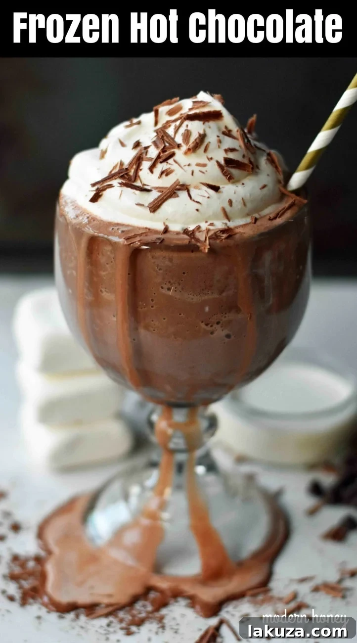 Arctic Chocolate Delight 8 Pin this Serendipity Frozen Hot Chocolate recipe. It's a rich, cold chocolate drink with whipped cream and chocolate shavings, perfect for a decadent homemade dessert.
