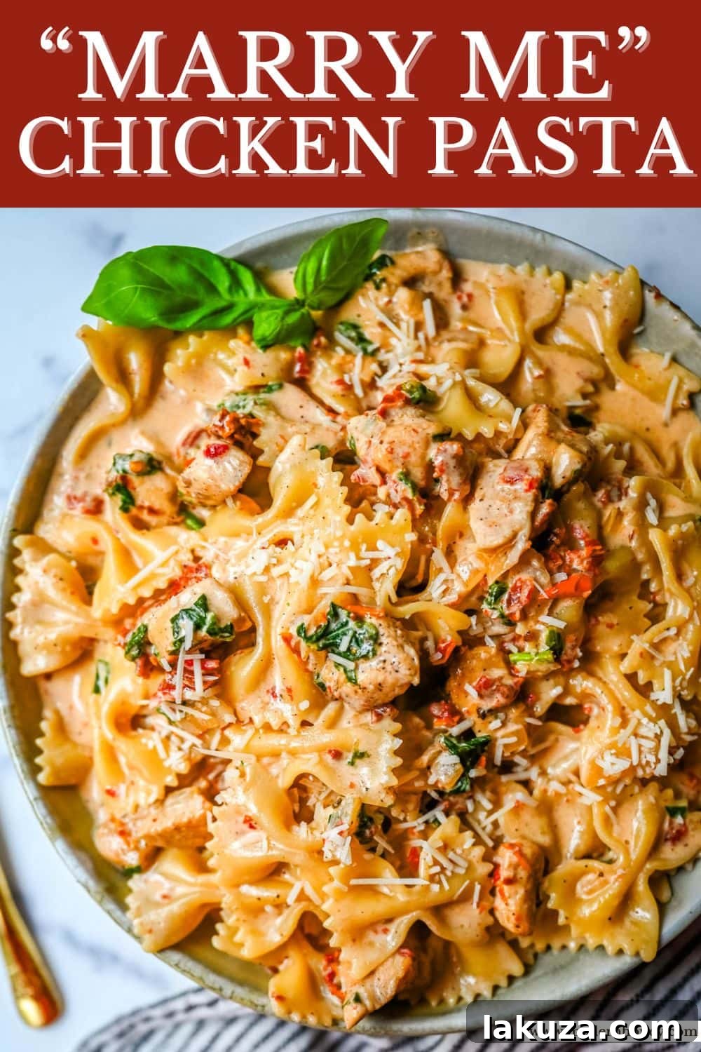 A large serving of Marry Me Chicken Pasta in a rustic bowl, with a fork ready to enjoy.