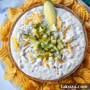 Creamy Dill Pickle Dip with fresh dill, cheddar, and spice, perfect for any party.