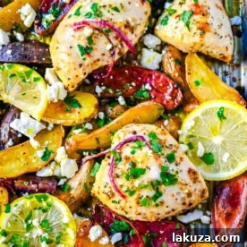 Sheet Pan Greek Chicken and Potatoes, a one-pan meal with marinated chicken, tender potatoes, and fresh herbs.