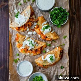 Crispy Buffalo Chicken Tacos with spicy chicken, melted cheese, and homemade jalapeño ranch dressing.