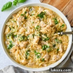 Creamy Cheesy Chicken Broccoli Orzo Skillet, a 30-minute meal with sautéed chicken, fresh broccoli, and orzo pasta.
