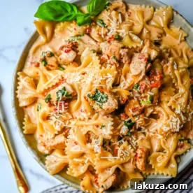 Creamy Marry Me Chicken Pasta featuring tender chicken, sun-dried tomatoes, and parmesan in a rich sauce.