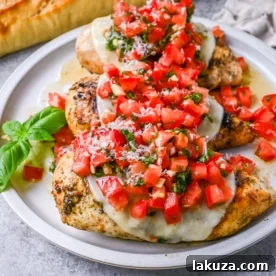 Bruschetta Grilled Chicken with juicy tomatoes, garlic, basil, and melted mozzarella over tender chicken breasts.