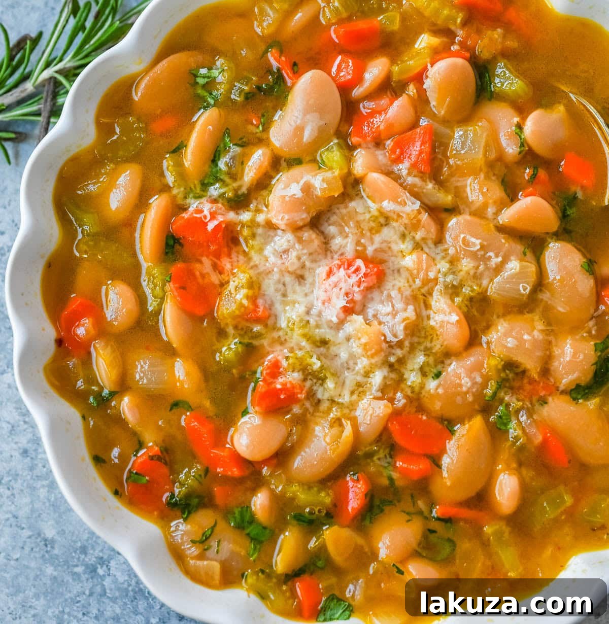 Tuscan White Bean Soup in a bowl with a spoon