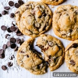 Chocolate Chip Coconut Cookies. Soft, chewy chocolate chip coconut cookies with semi-sweet chocolate and sweetened flaked coconut. The perfect chocolate coconut cookies! www.modernhoney.com #cookies #chocolate #chocolatechipcookie #chocolatechipcookies #chocolatechipcoconut